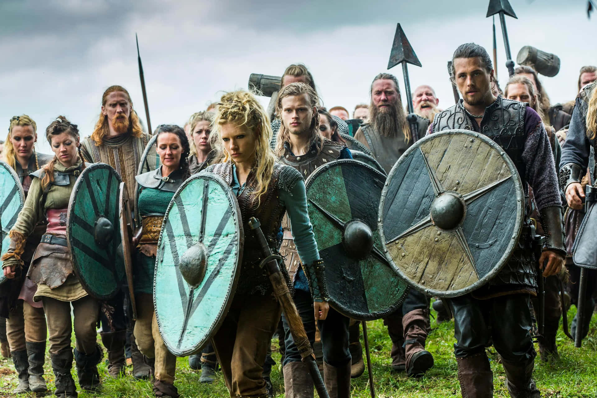 Emerald colored robes and war-slashed faces - Female Viking Warriors have endured the battle of time