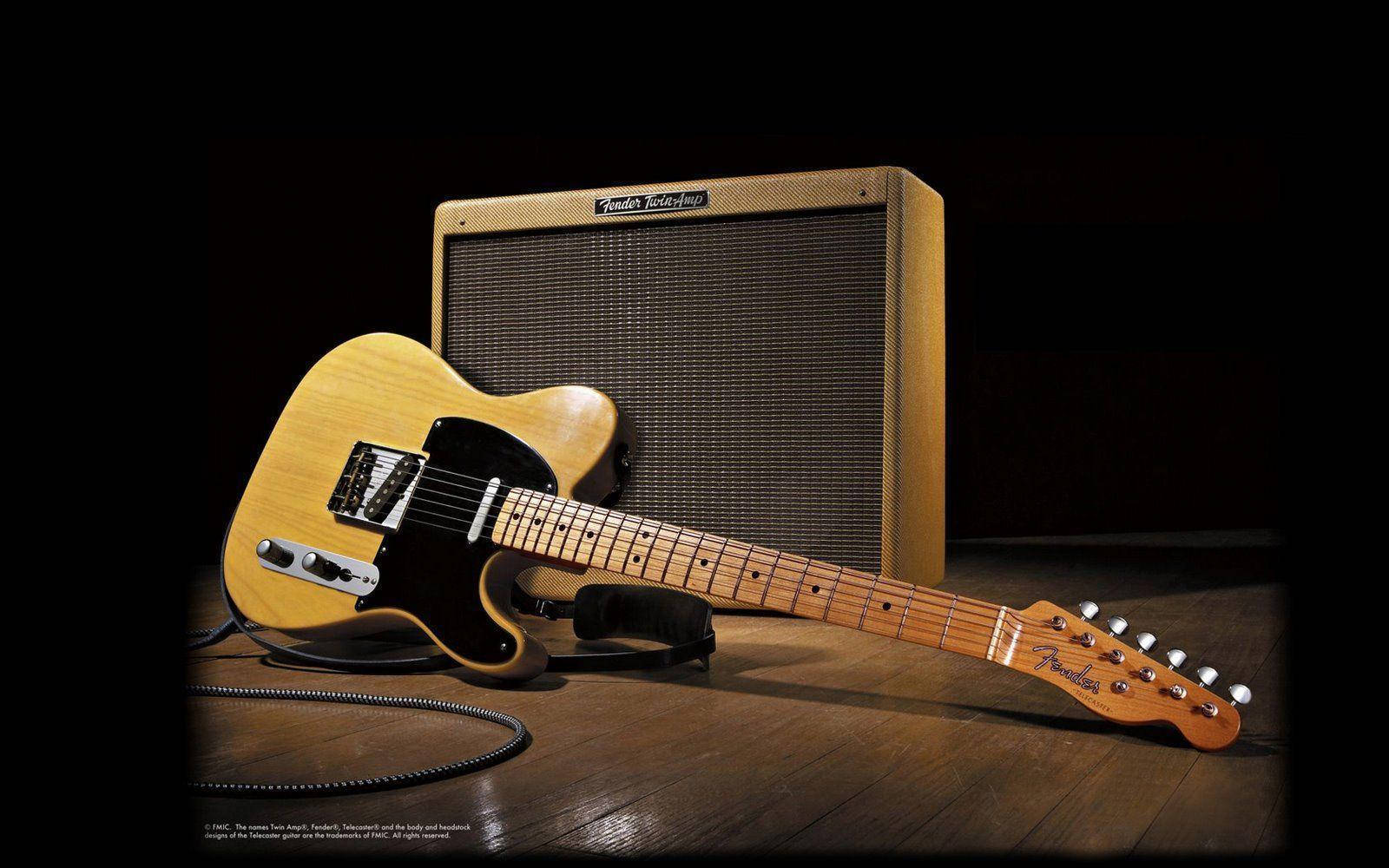 Achieve Legendary Tone with a Fender Electric Guitar & Twin Amp Wallpaper