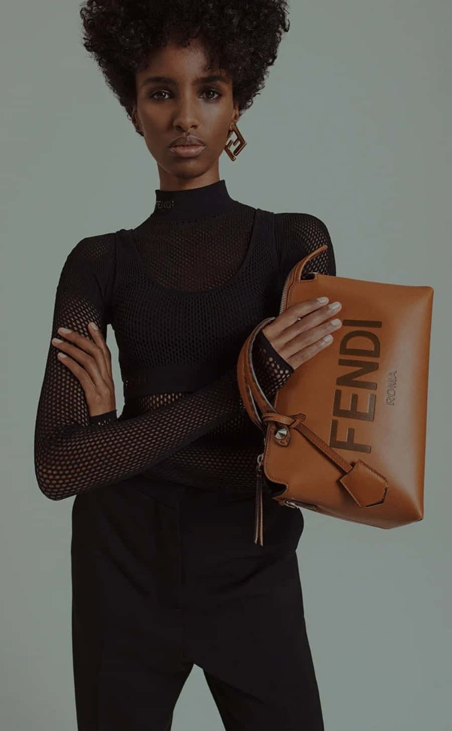 A girl models a Fendi leather-look jumpsuit