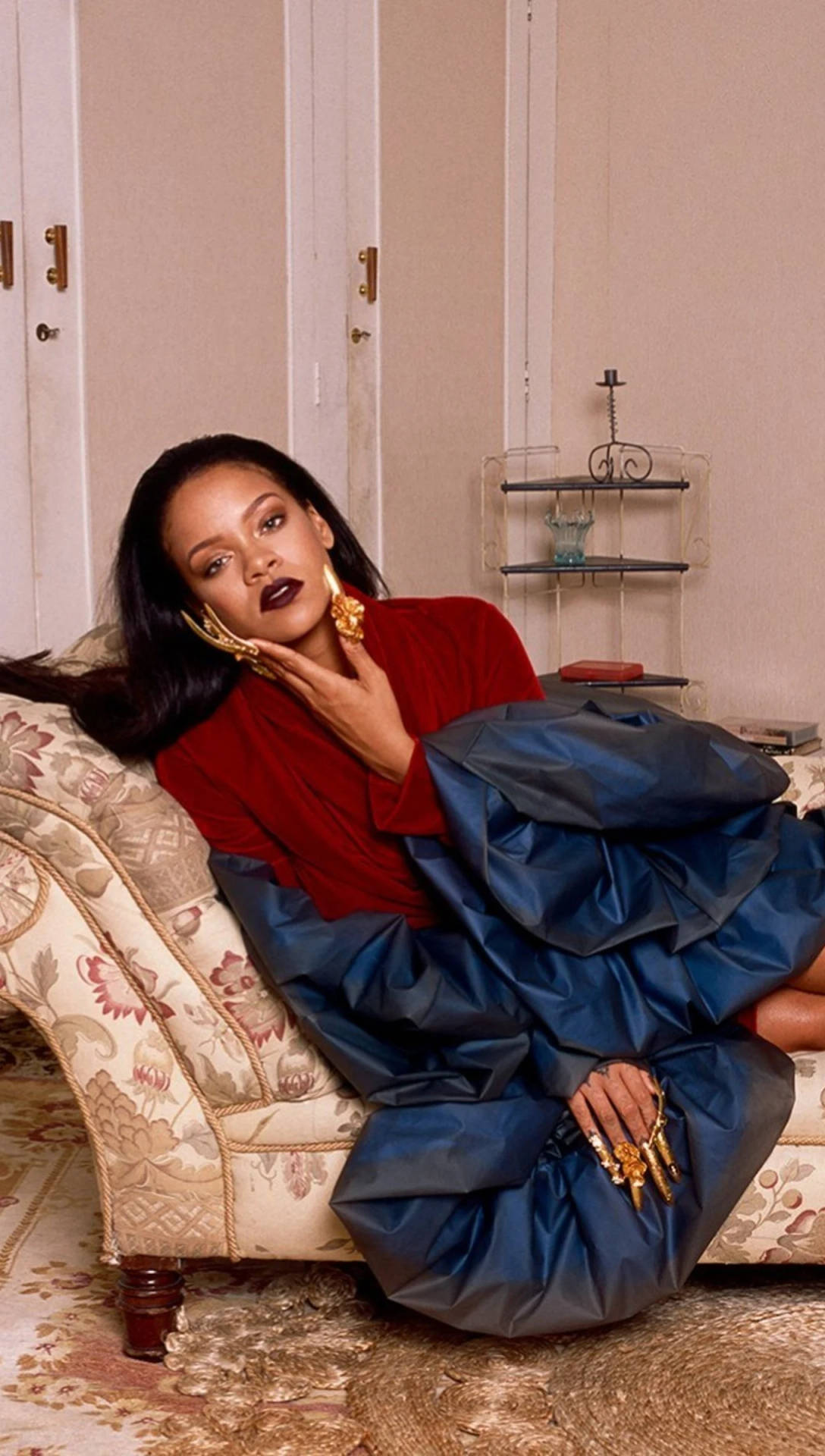 Fenty Rihanna Posing On A Couch Wallpaper