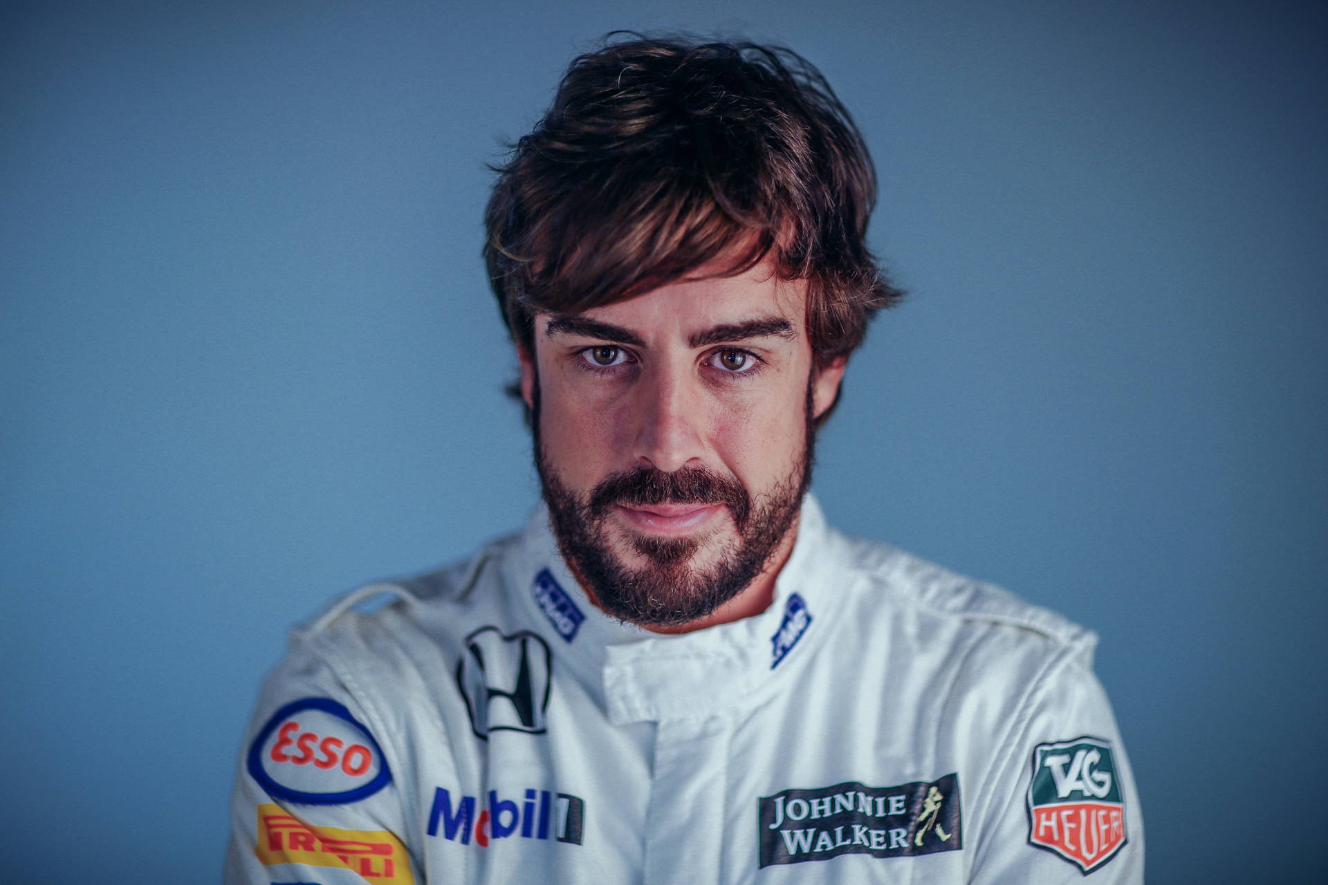 Fernando Alonso Geared Up in His Bright White Racing Suit Wallpaper