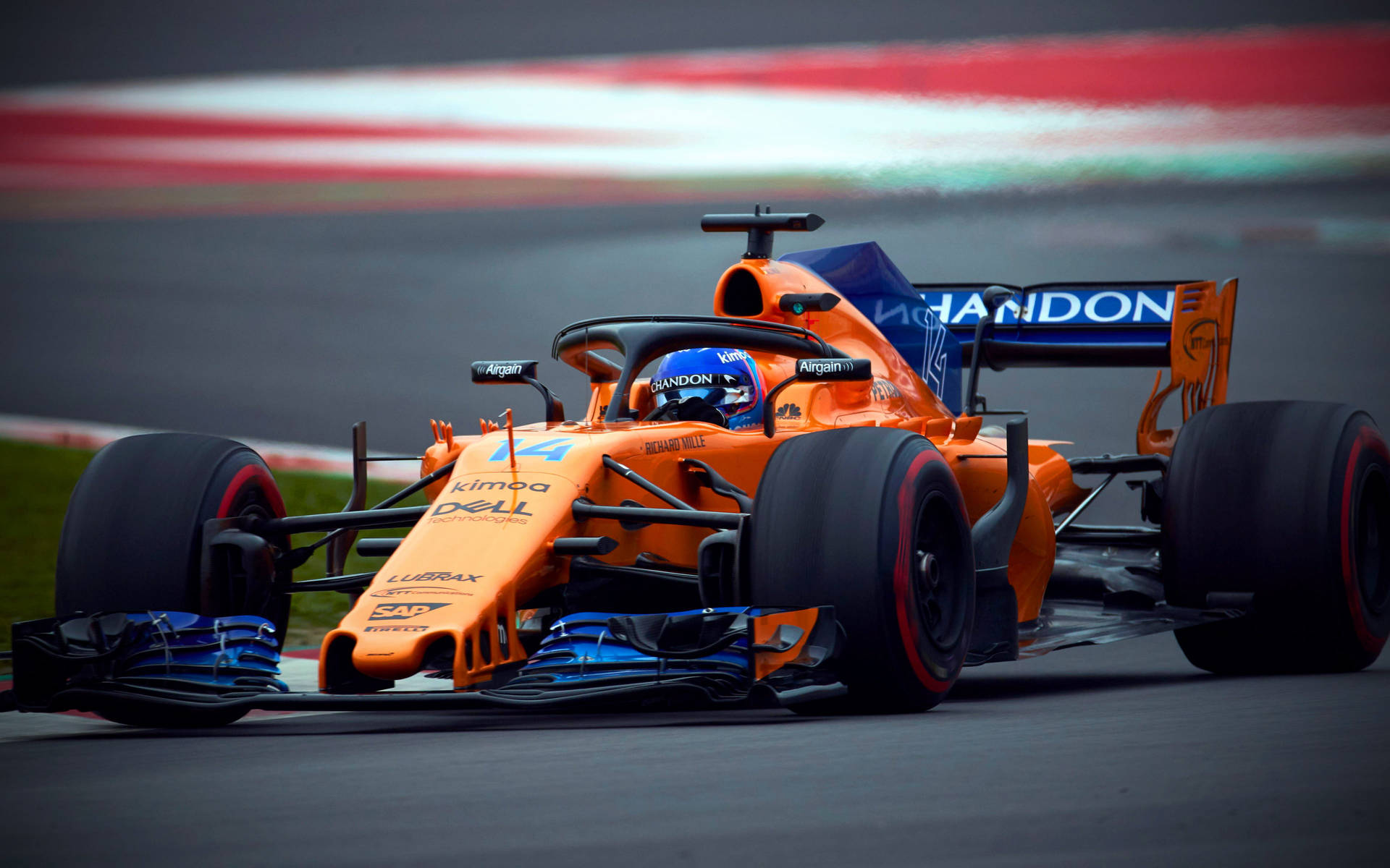 Caption: Fernando Alonso Racing in Orange McLaren Wallpaper
