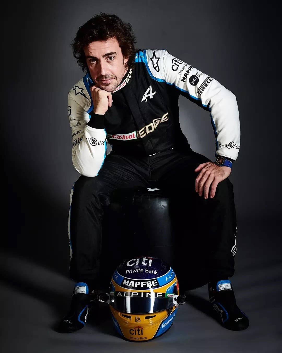 Fernando Alonso Sitting With Helmet Wallpaper