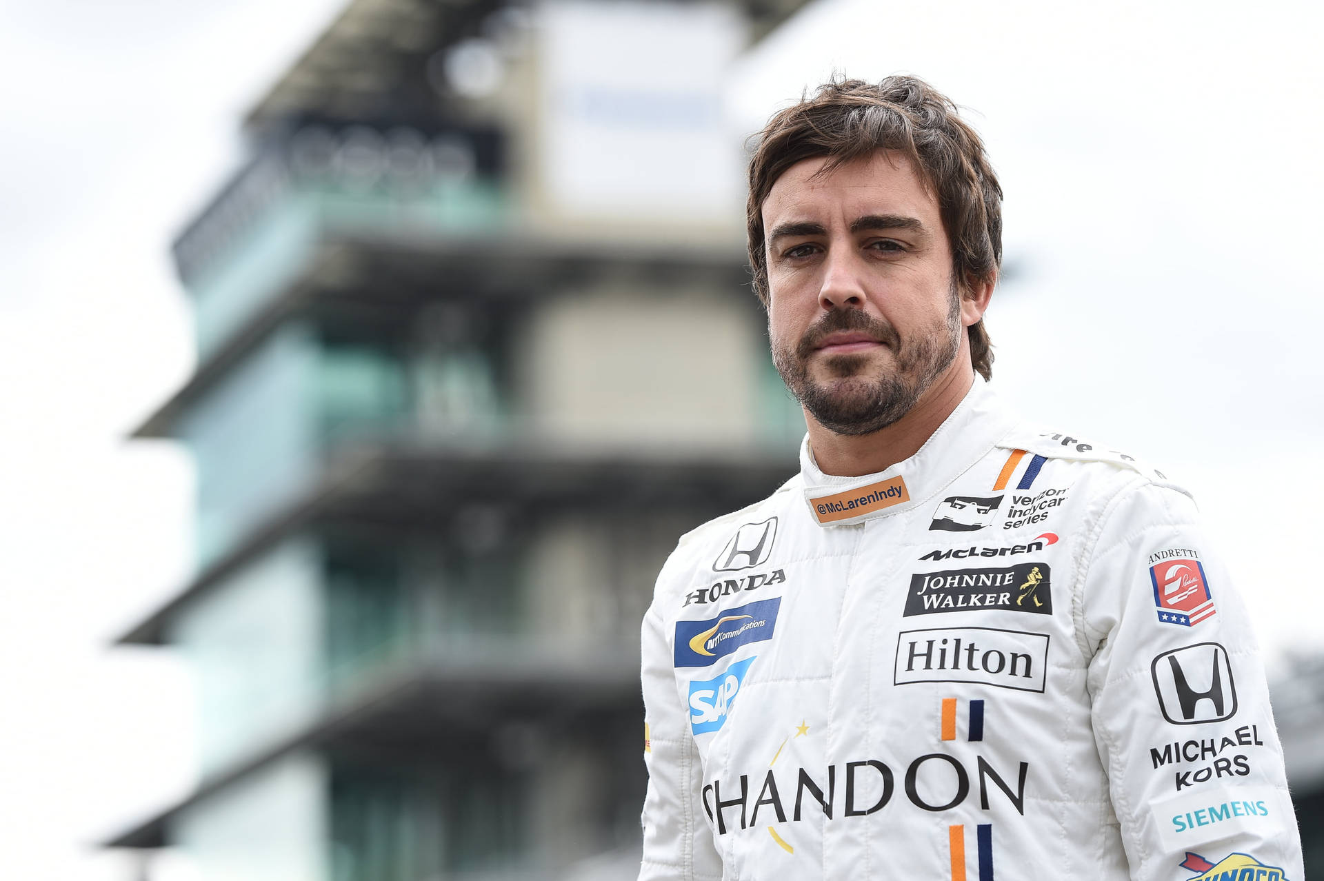 Fernando Alonso White Racing Suit Wallpaper