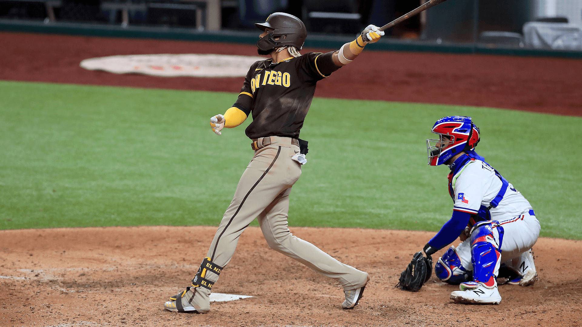 Fernando Tatis Jr slams a solo home run during a San Diego Padres game. Wallpaper