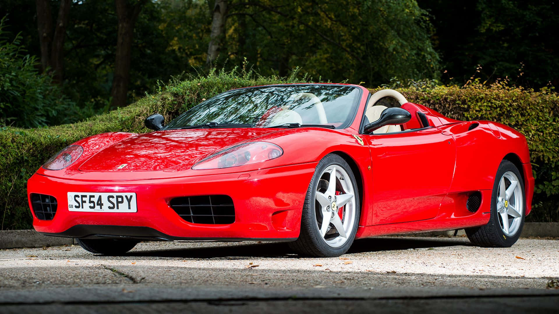 Eleganteferrari 360 Modena Rojo En La Carretera Fondo de pantalla