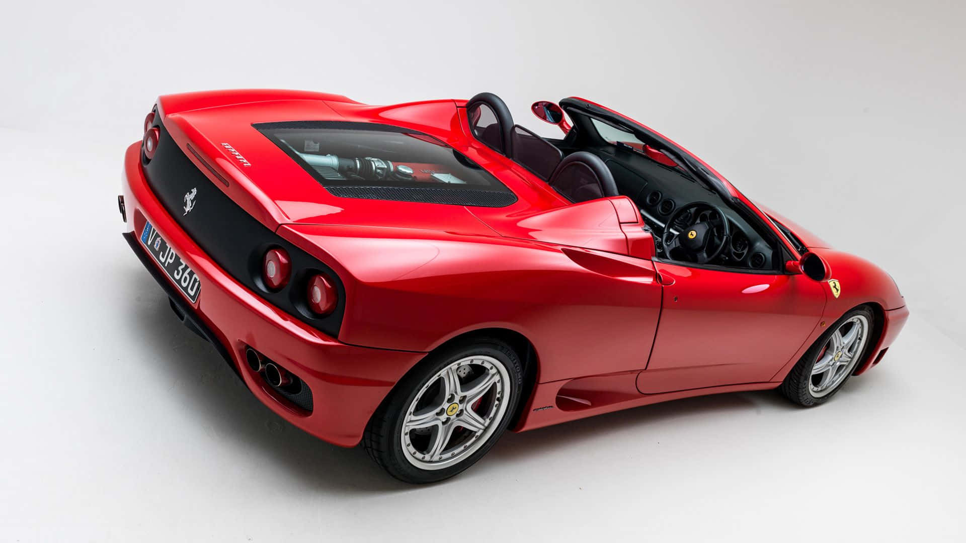 Stunning Red Ferrari 360 Modena in Action Wallpaper