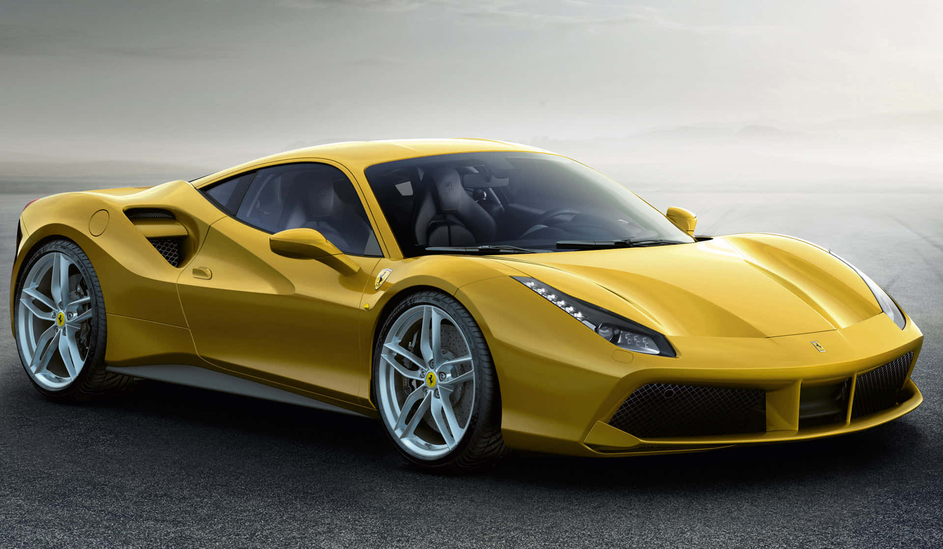 The stunning Ferrari 488 Spider in action on a scenic road Wallpaper