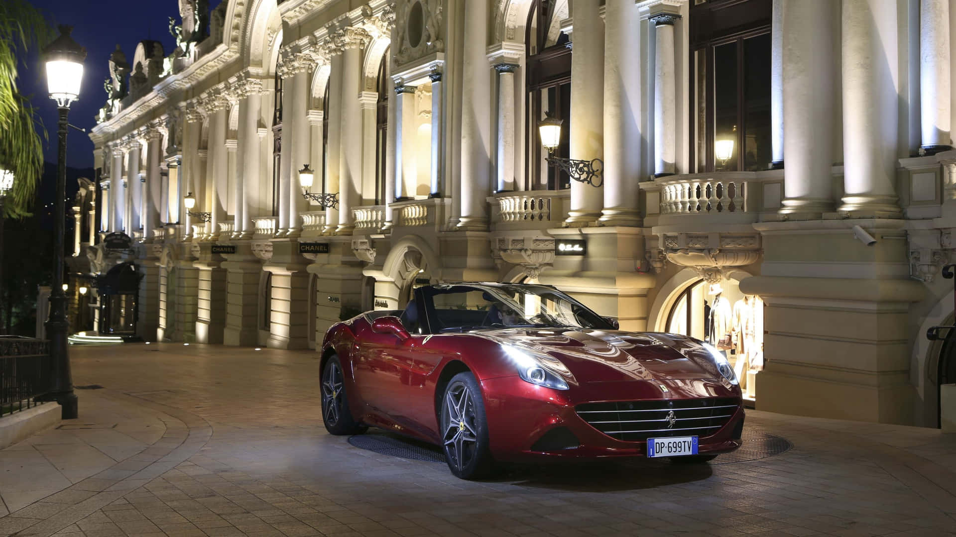 Caption: Stunning Red Ferrari California T in Motion Wallpaper