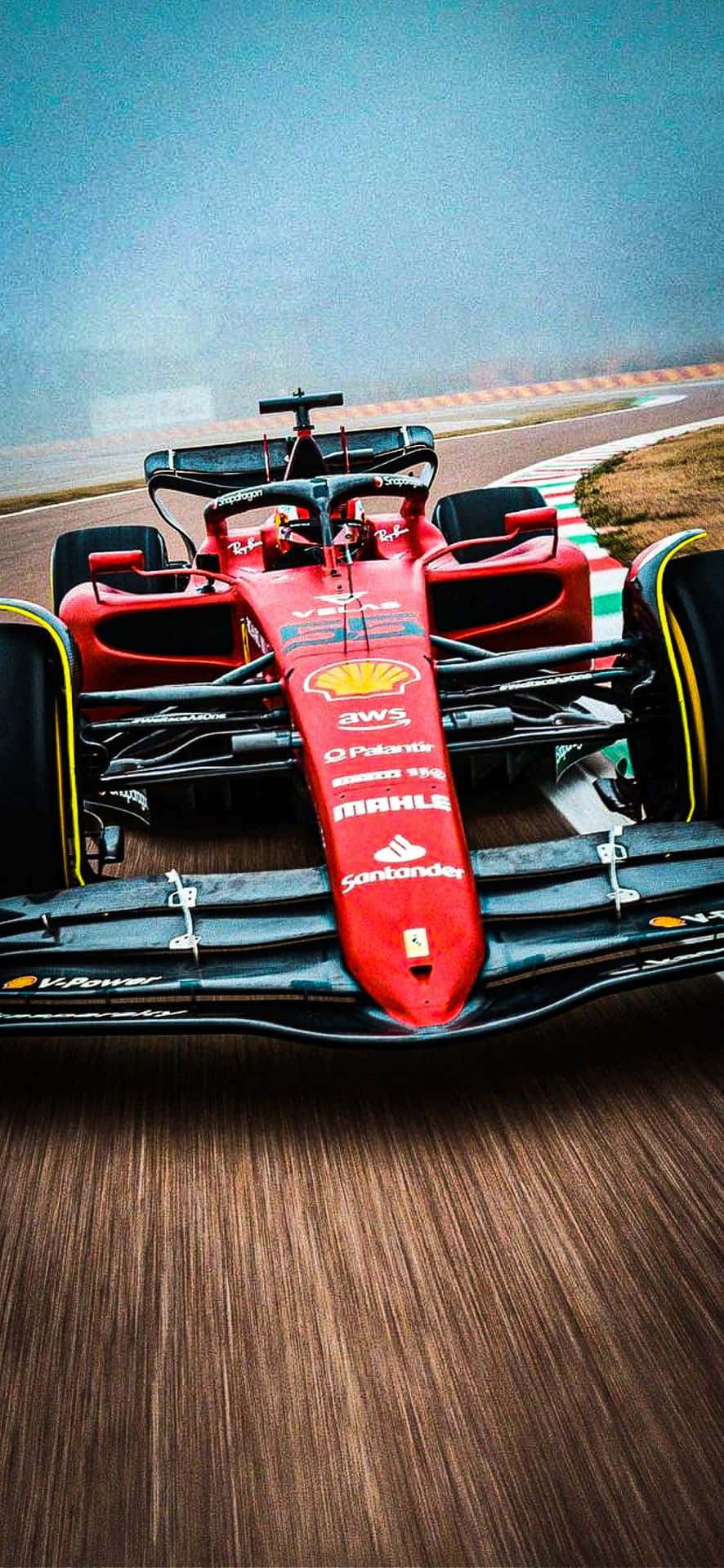 Ferrari F1 Car Driving On A Track Wallpaper