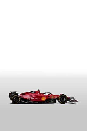 Cochede Fórmula 1 De Ferrari En Un Fondo Gris Fondo de pantalla
