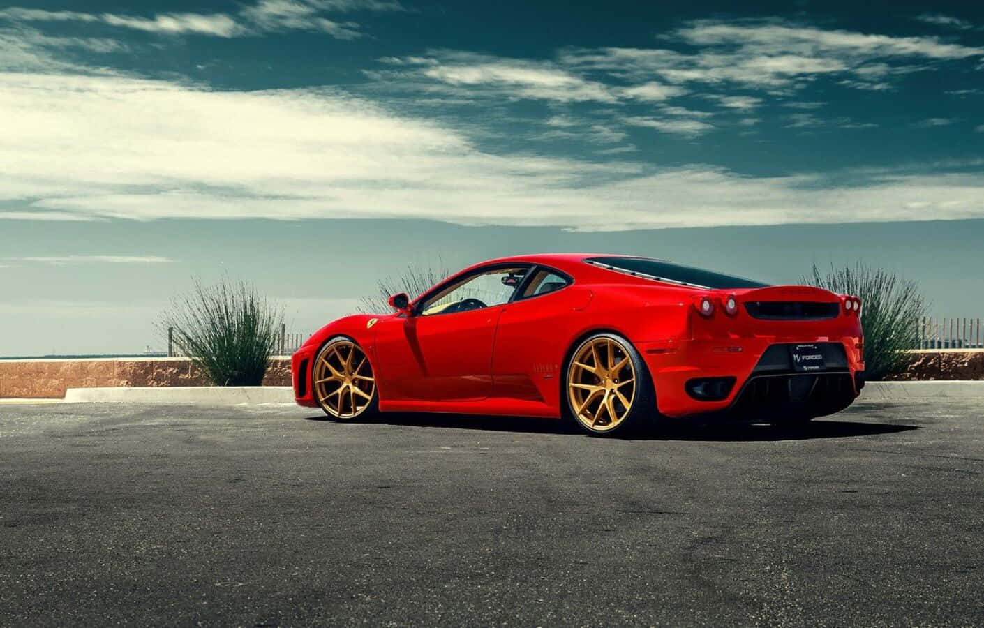 Stunning Red Ferrari F430 on the Road Wallpaper