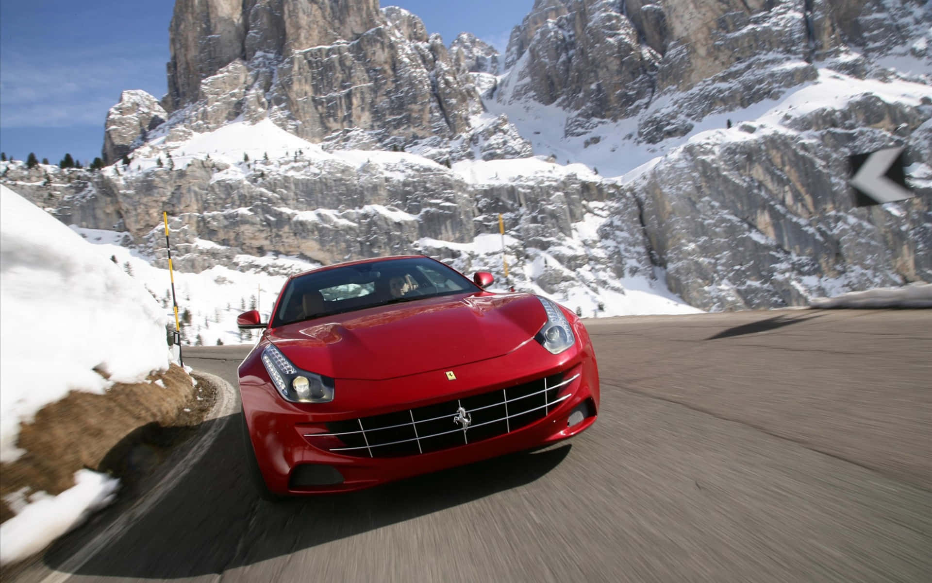 Sleek and Powerful Ferrari FF on a Stunning Scenic Road Wallpaper