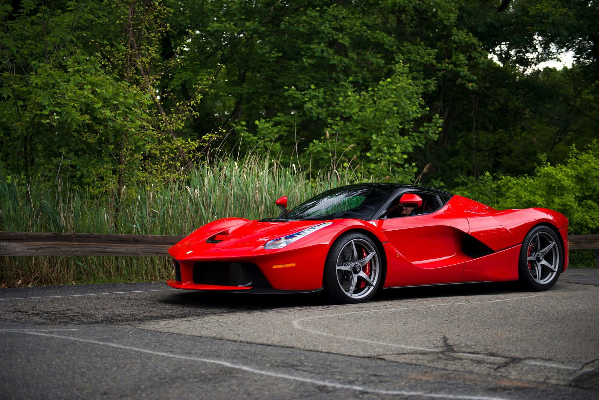 Stunning Shot of a Red Ferrari LaFerrari in Motion Wallpaper