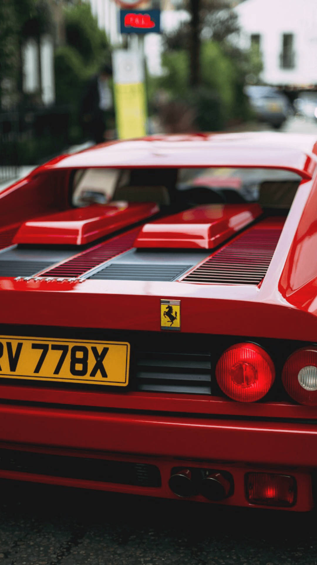 Classicotelefono Ferrari Con Supercar Rossa Sfondo