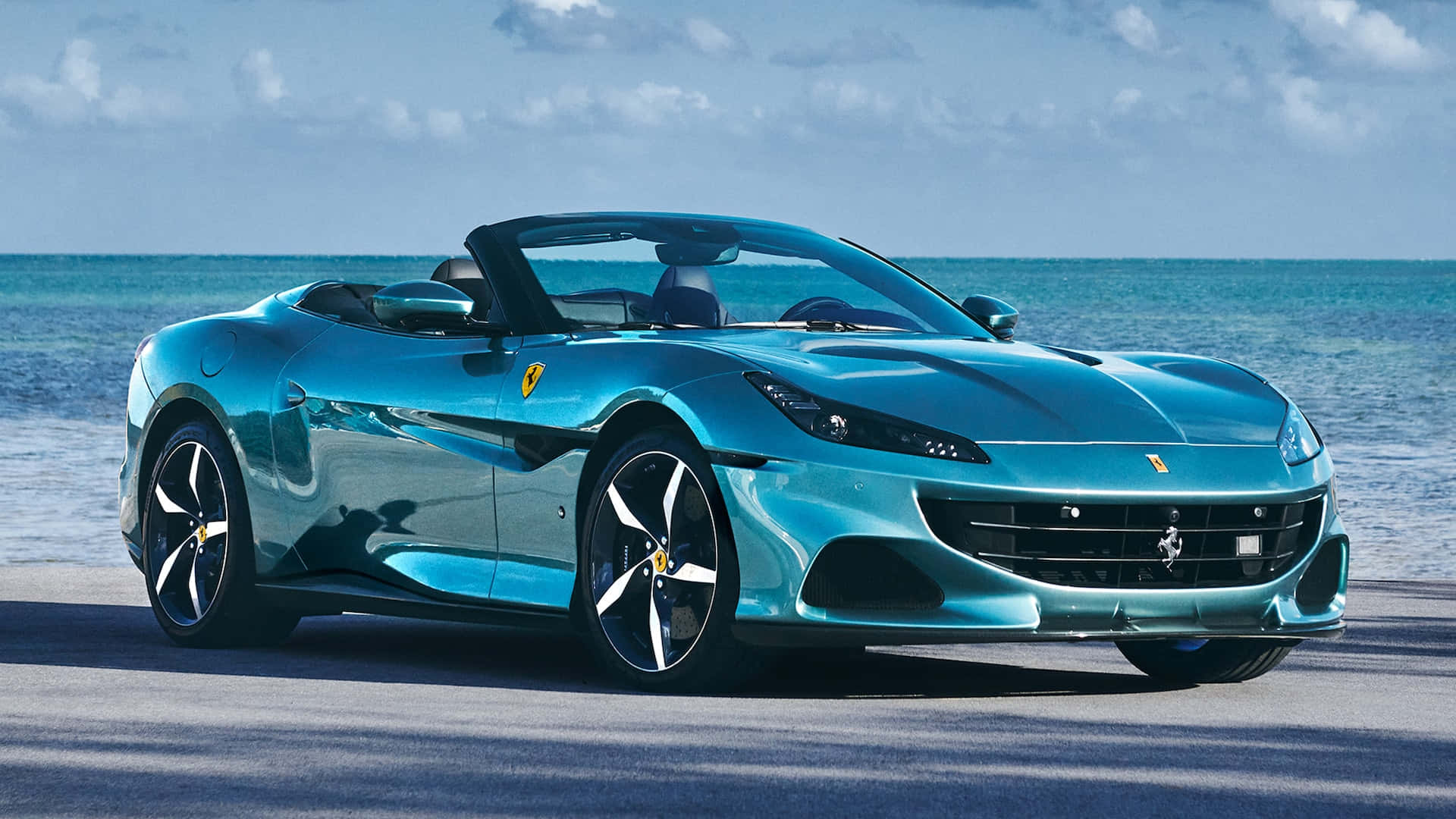 Bijschrift: De Opwindende Ferrari Portofino In Zijn Volledige Glorie Achtergrond