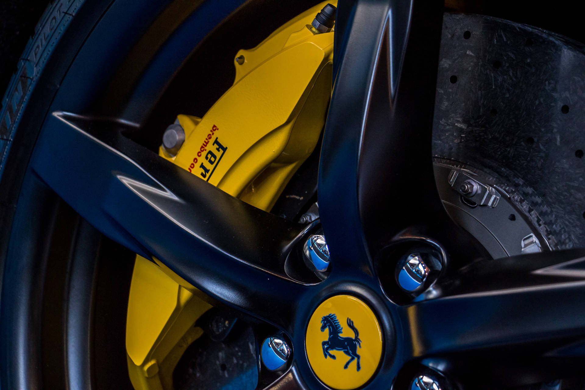 Ferrari sports car wheel with logo close-up wallpaper.