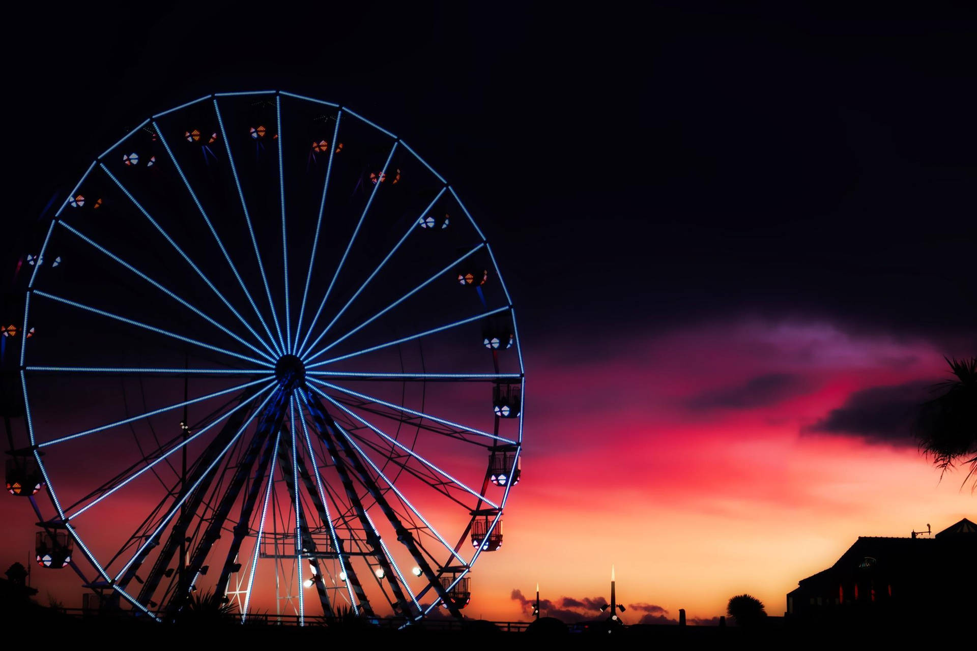 Ferris Wheel Med Drømmende Solnedgang Wallpaper