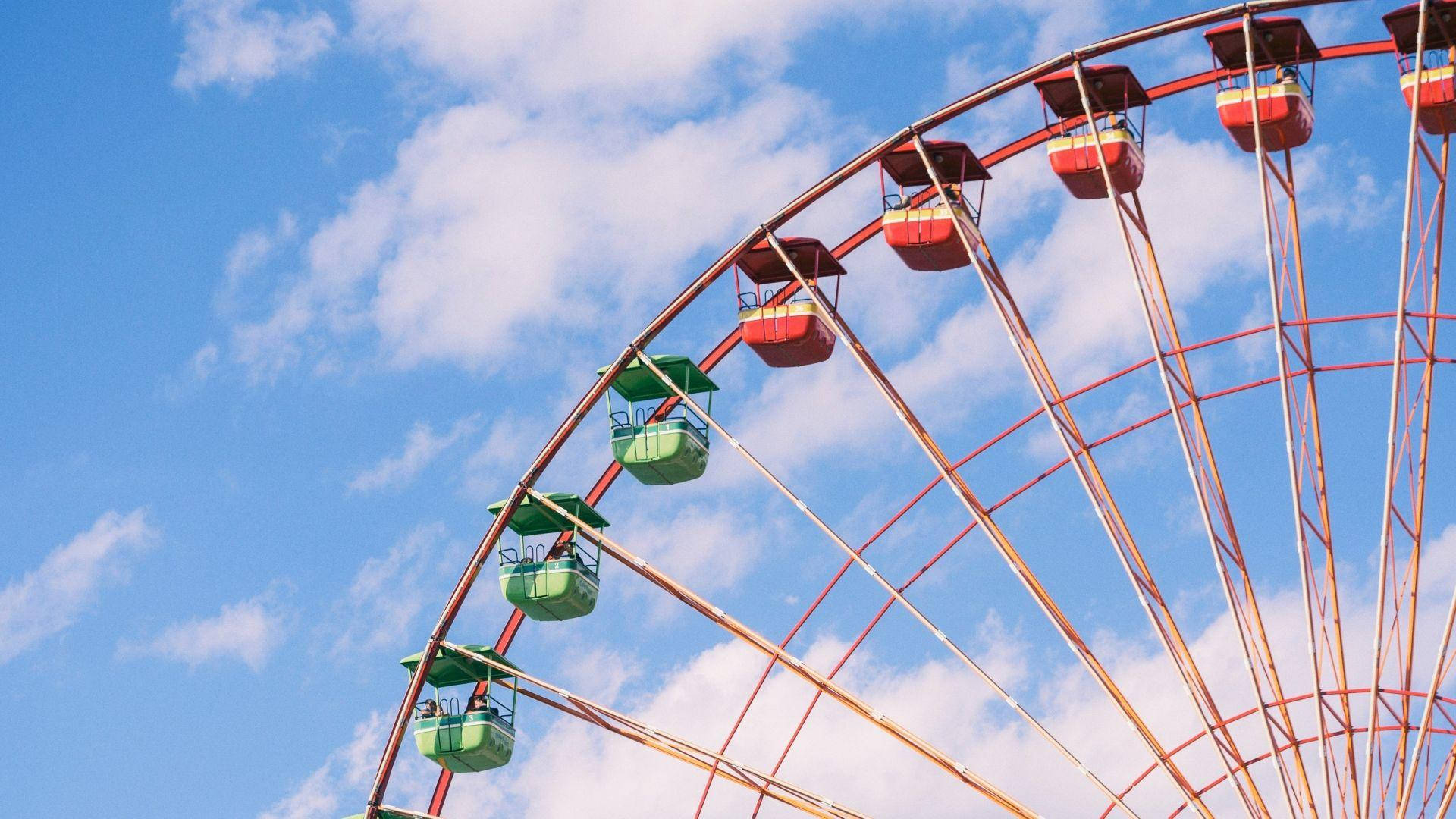 Ferris Wheel With Green And Red Pods Wallpaper