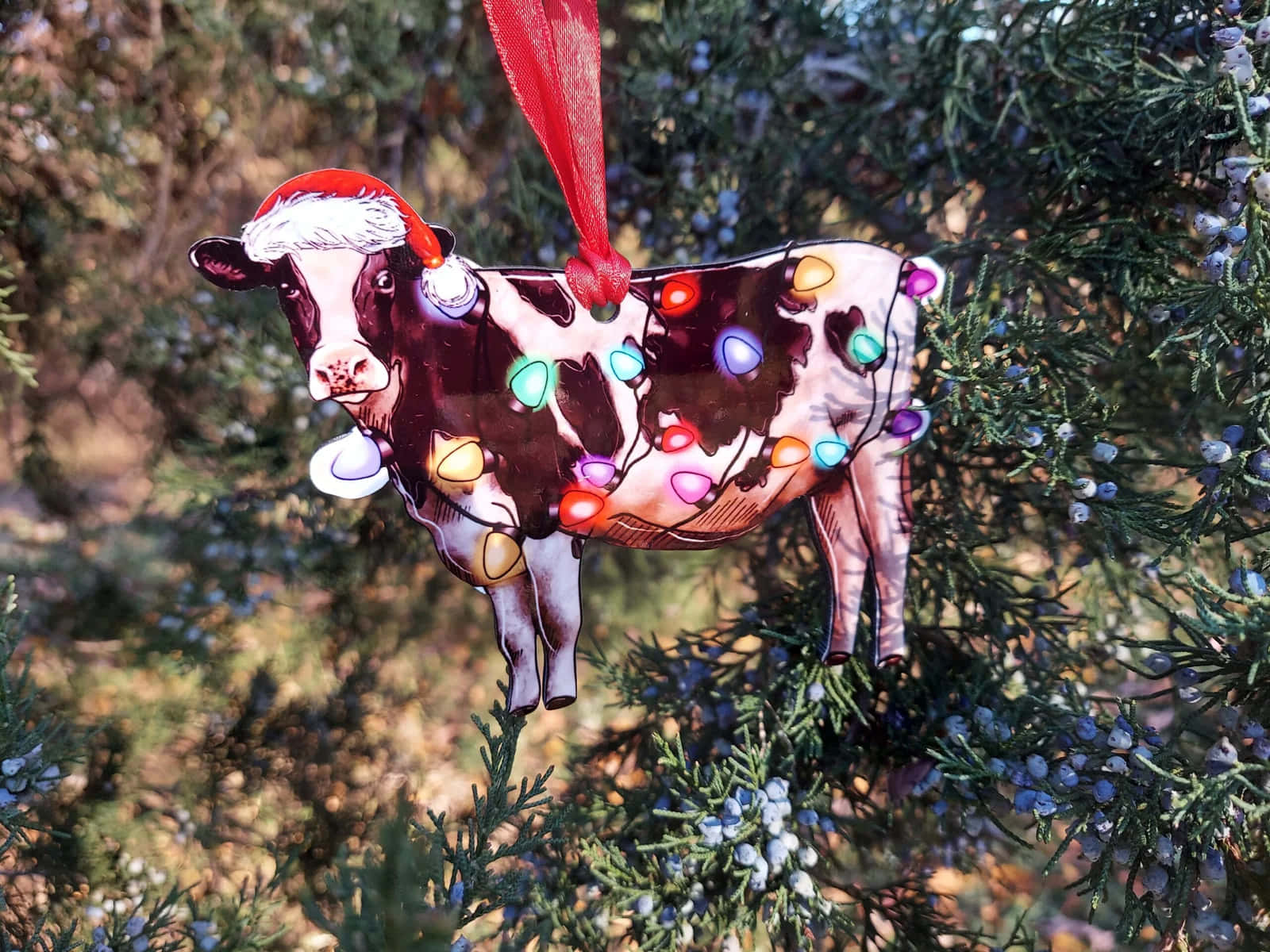 Festive Christmas Cow Ornament Wallpaper