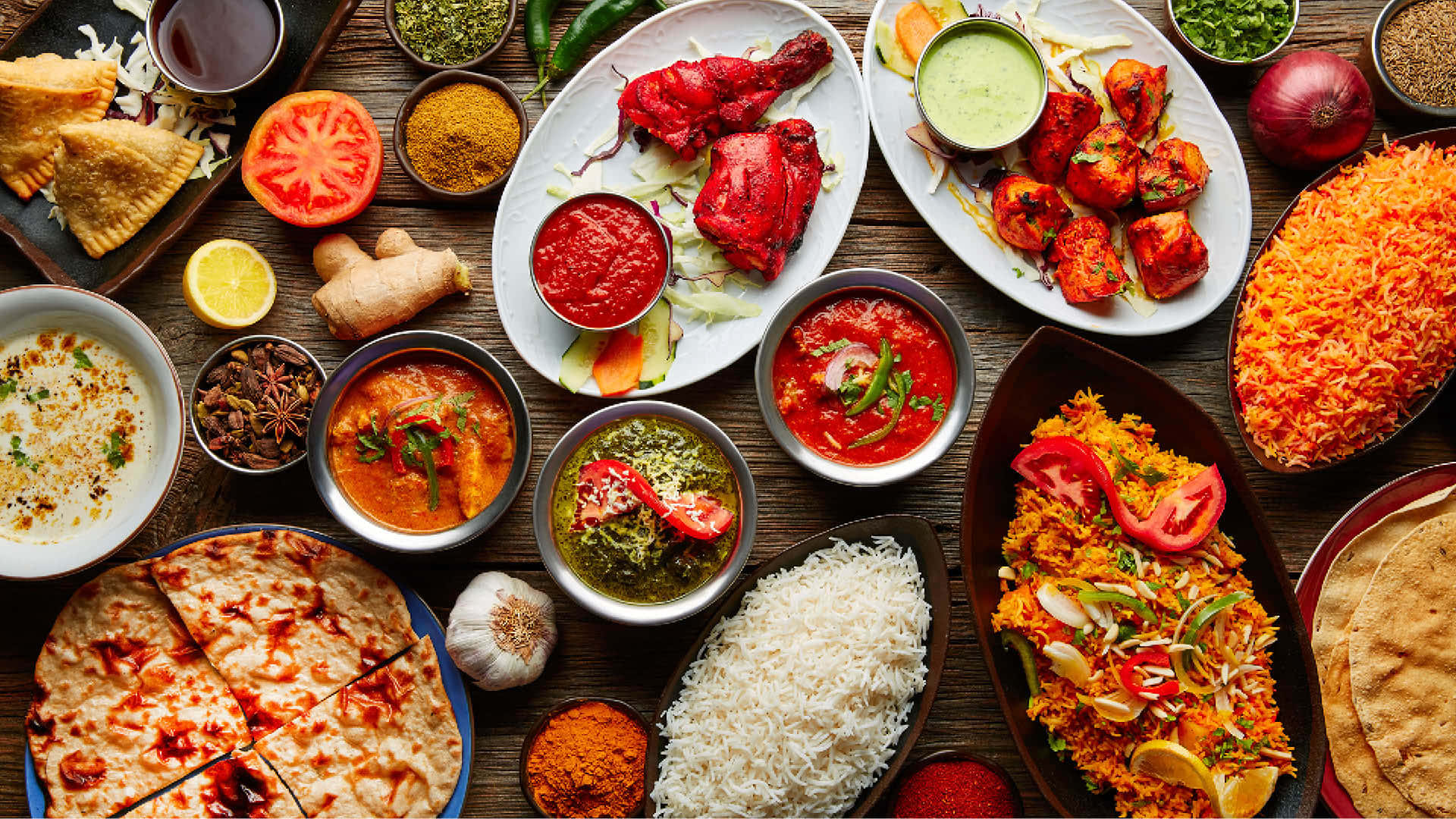 Festive Indian Food With Rice And Chicken Wallpaper
