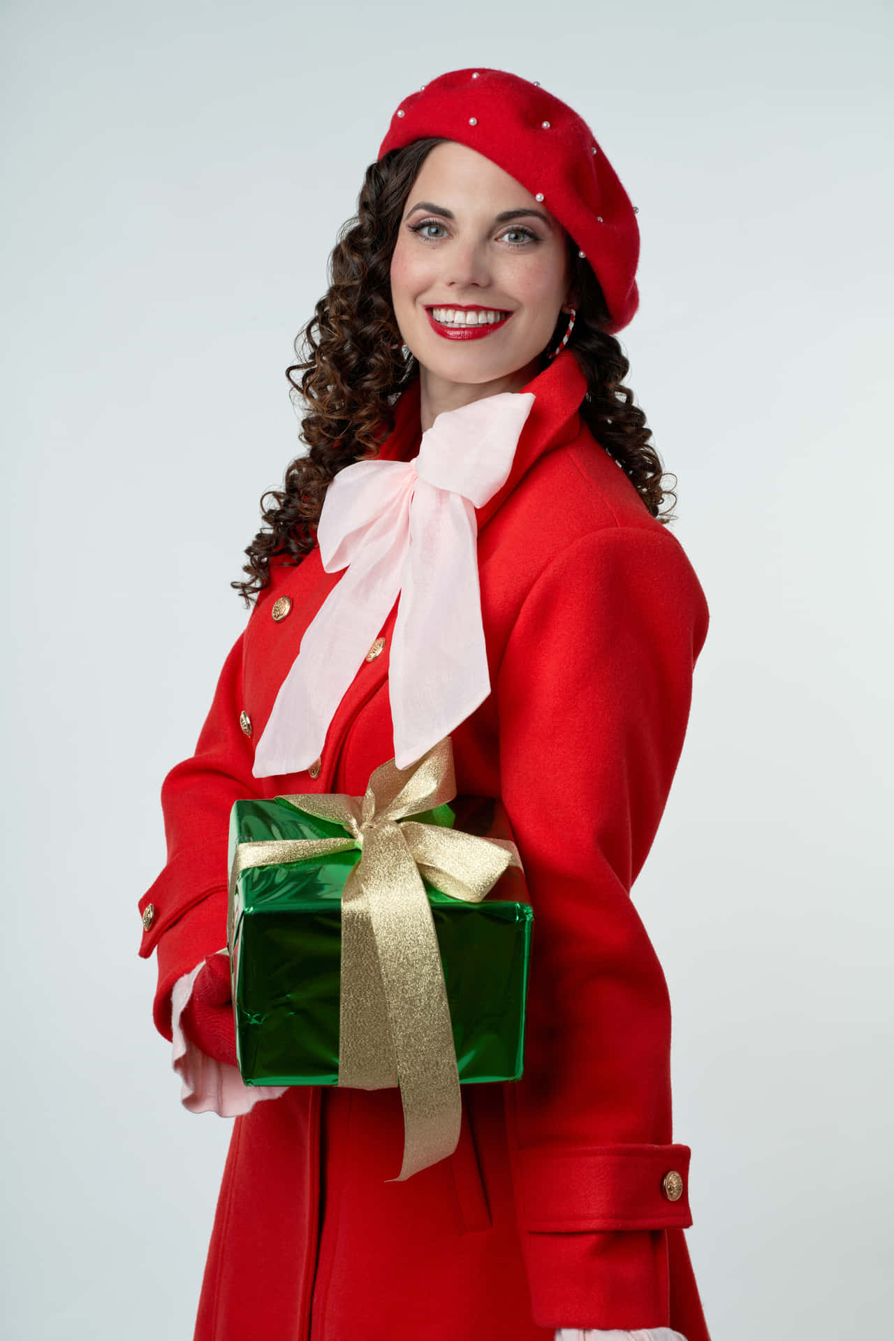 Festive Woman Holding Gift Wallpaper