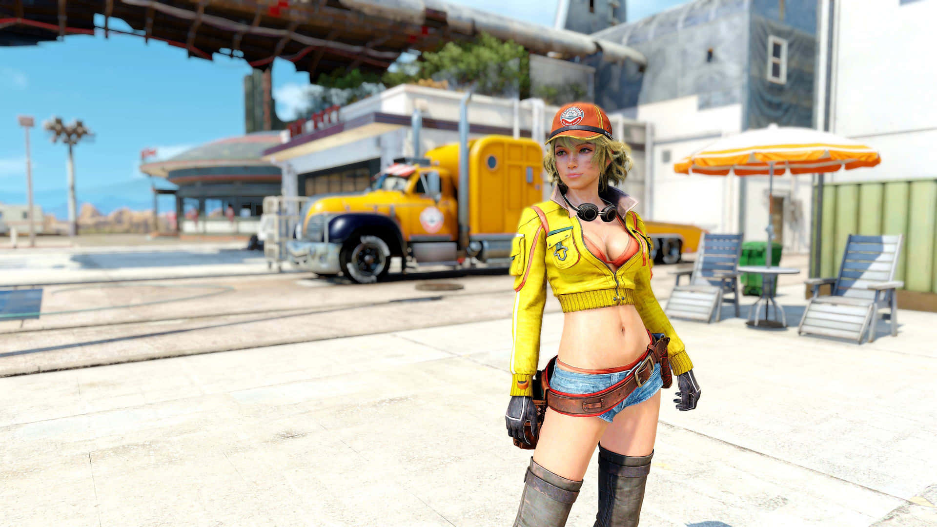 A Woman In A Yellow Shirt And Boots Is Standing In Front Of A Truck Wallpaper