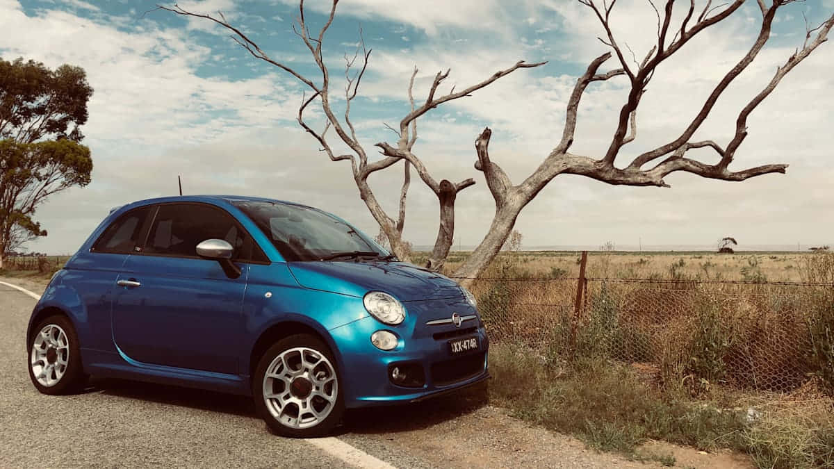 Stylish Fiat 500 in Action Wallpaper