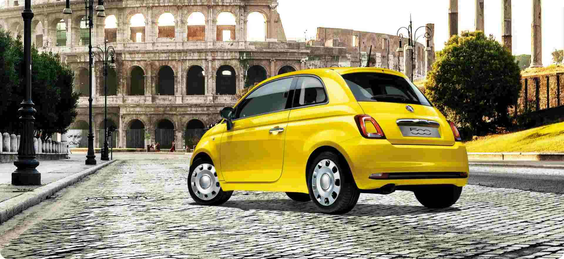 Classic Fiat 500 in a picturesque setting Wallpaper