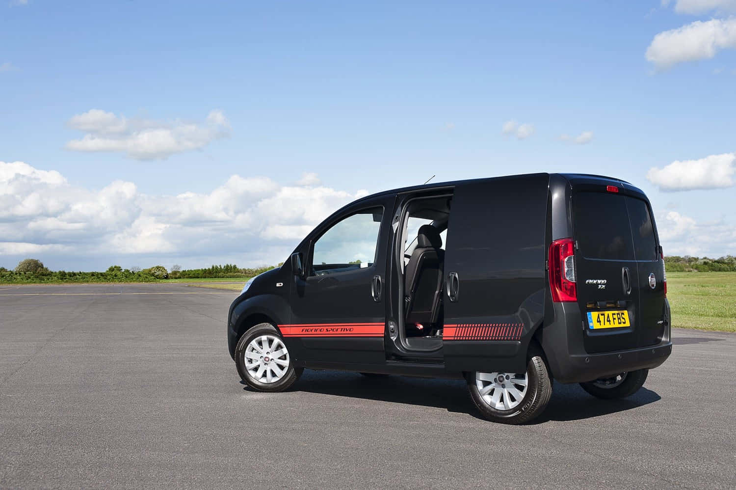 Fiat Fiorino showcasing performance and reliability in a stunning landscape Wallpaper