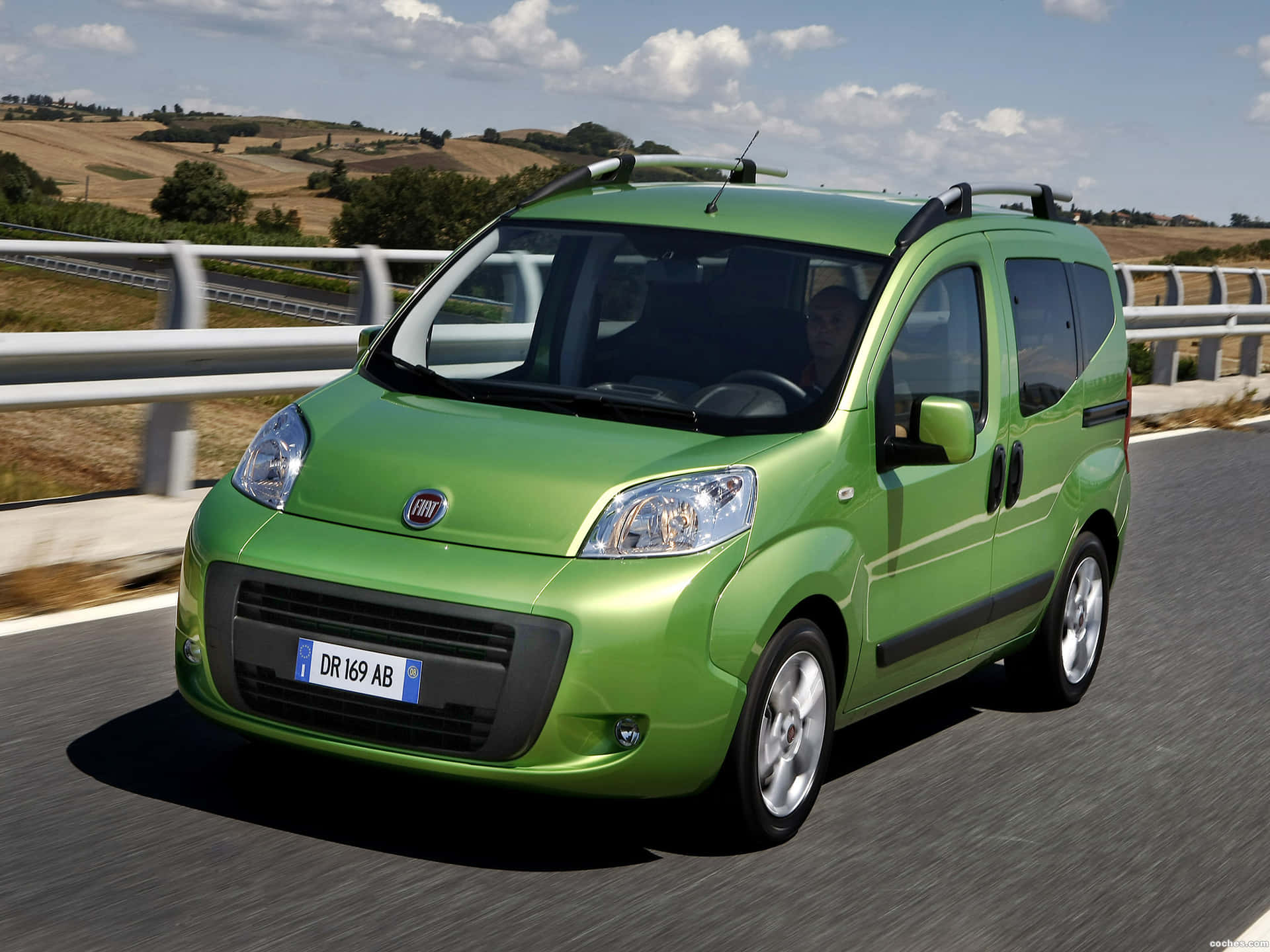 A stylish and practical Fiat Fiorino van parked in a picturesque location Wallpaper