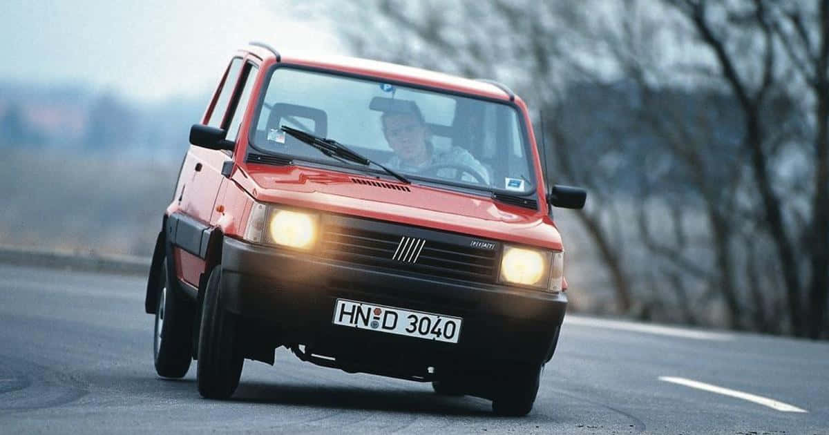 A Fiat Panda parked in a serene, picturesque location Wallpaper