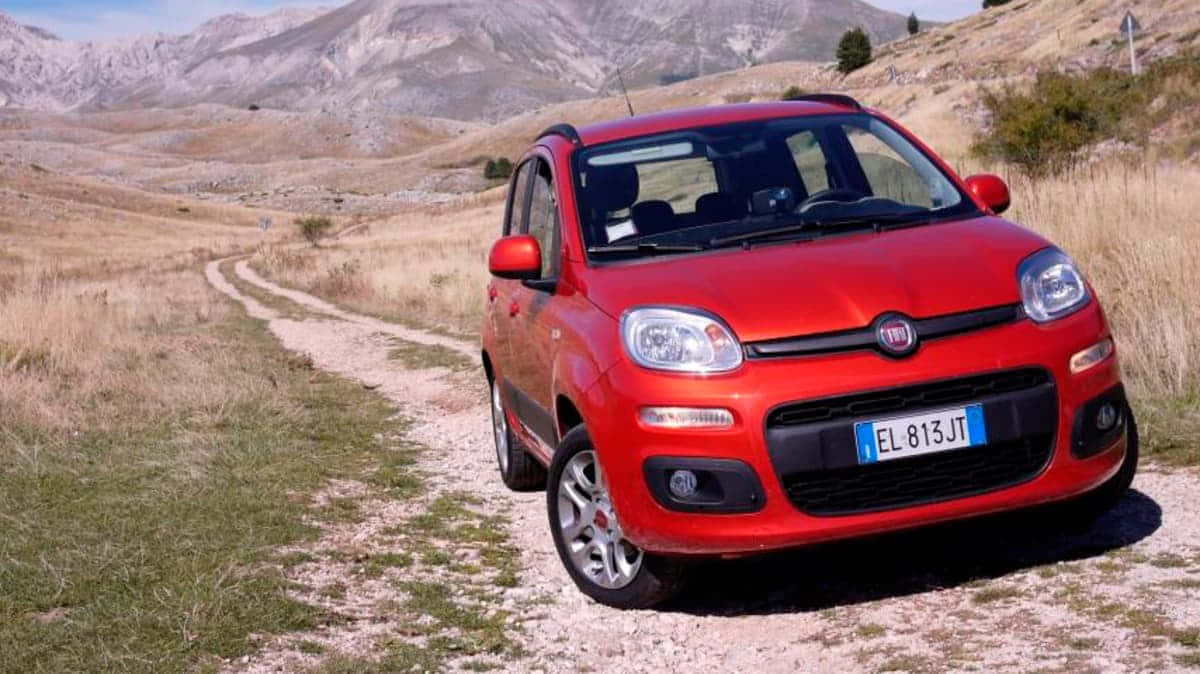 Stylish Fiat Panda in action on city streets Wallpaper