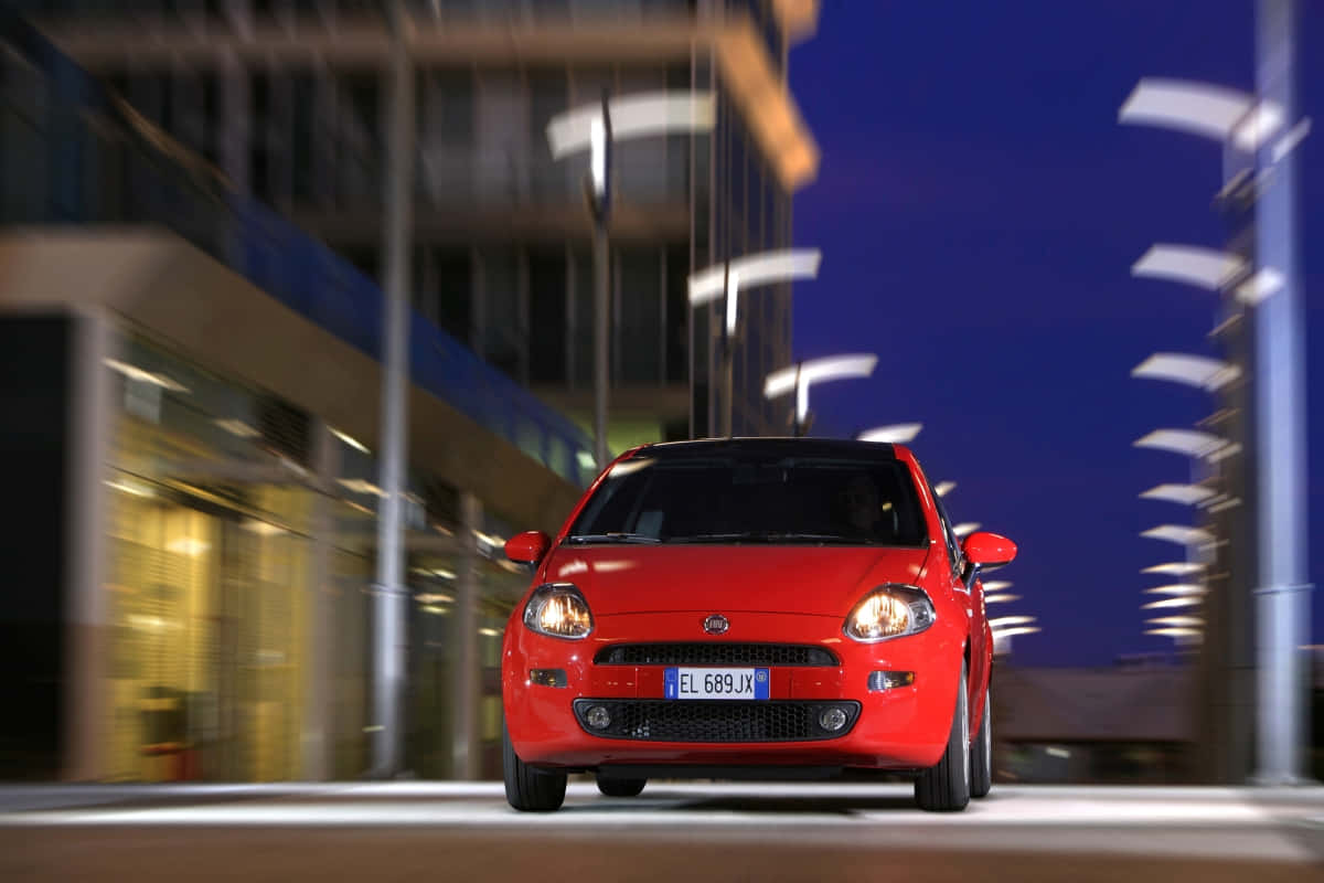 Stunning Red Fiat Punto on the Road Wallpaper