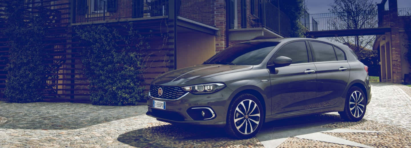 Sleek and Stylish 2021 Fiat Tipo on the Road Wallpaper