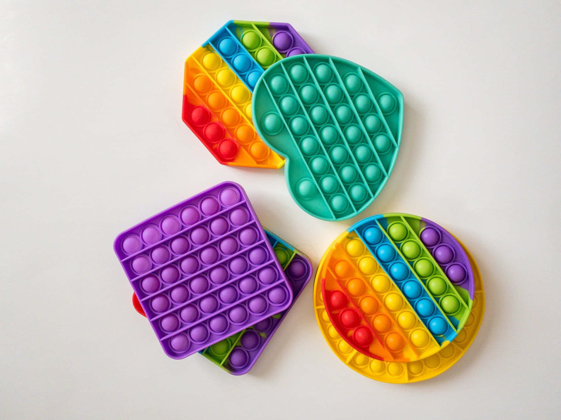 A Set Of Colorful Plastic Plates With Different Shapes