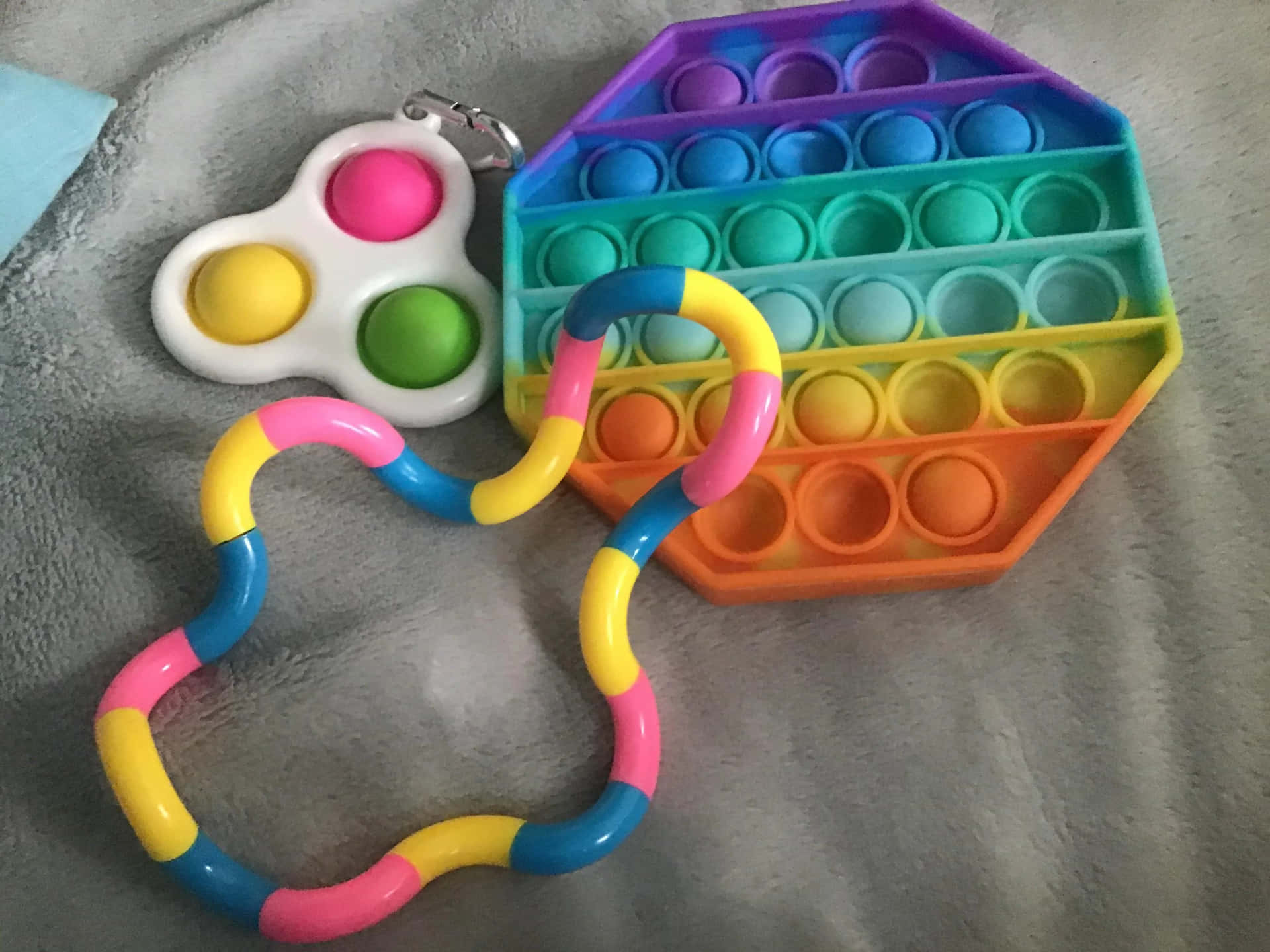 A Colorful Toy With A Colorful Ring And A Toy