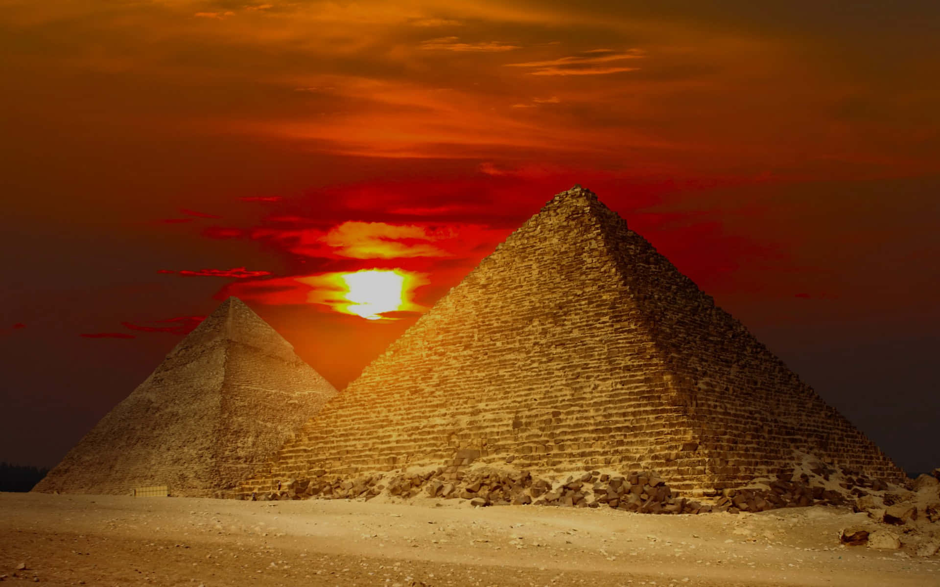Fiery Sunset Above Giza Pyramids Wallpaper