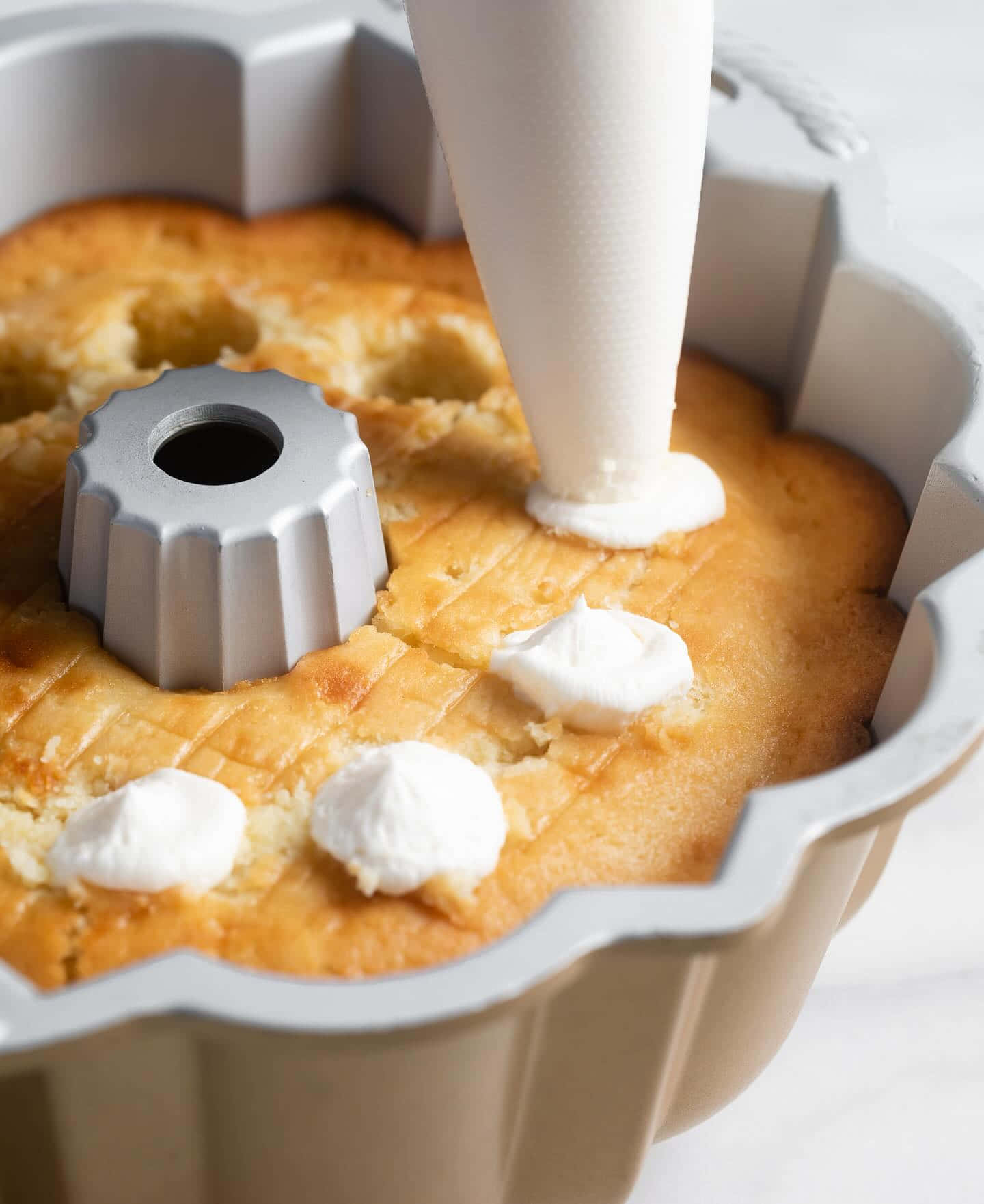 Filling Cream Into Cake Bundt Pan Wallpaper