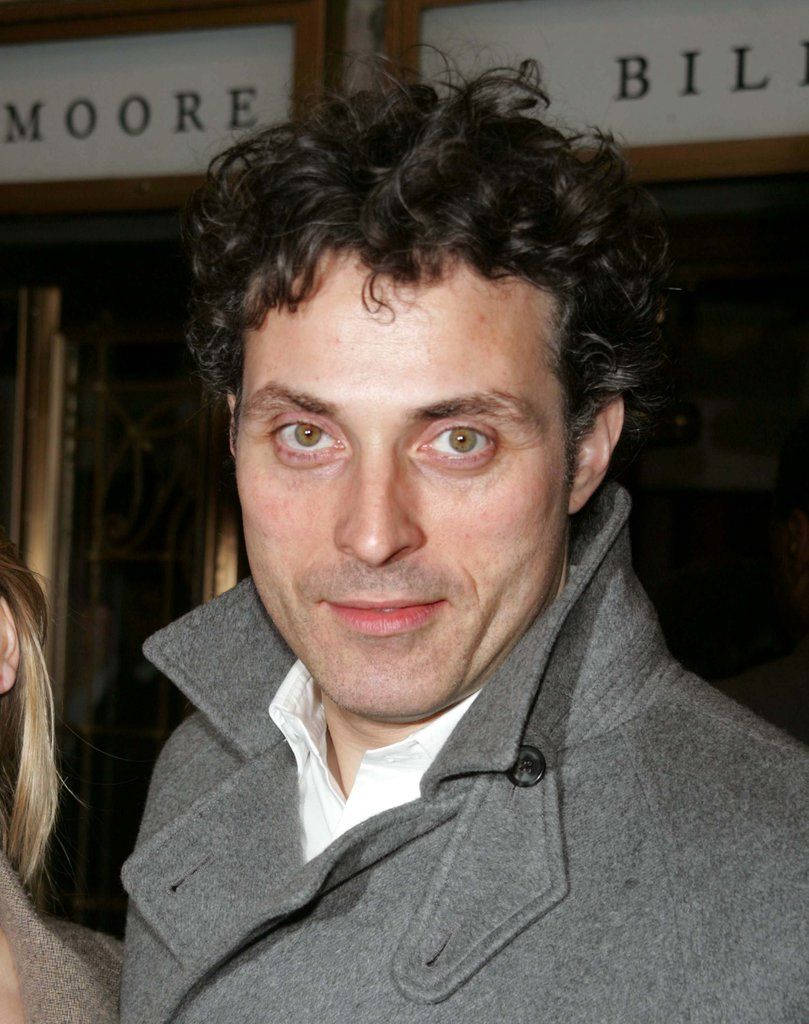 A close-up shot of actor Rufus Sewell with piercing dark green eyes. Wallpaper