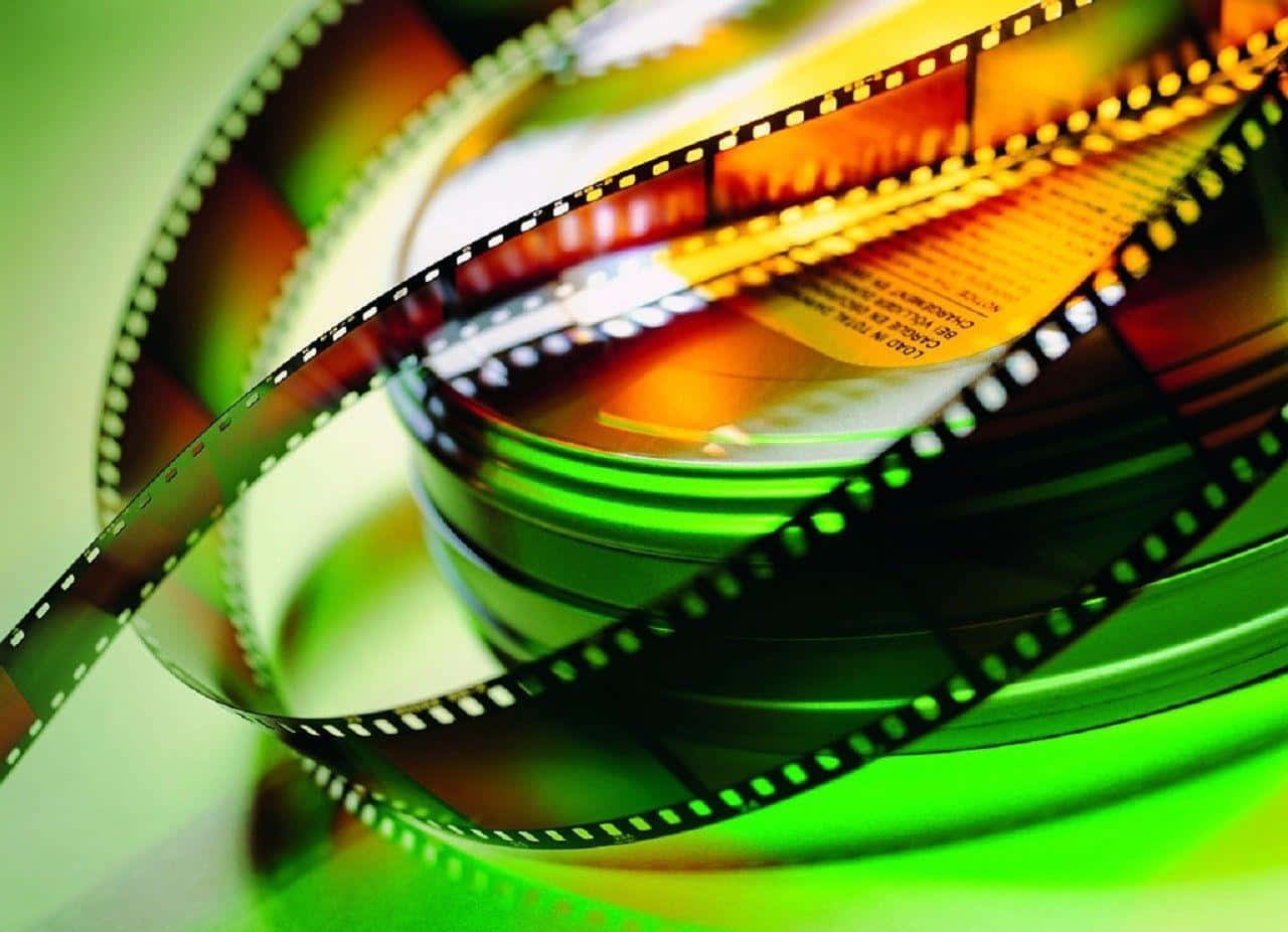 A Film Reel Is Shown On A Green Background