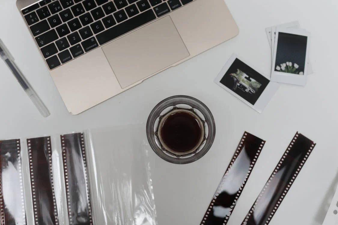 Film Photography With Coffee And Laptop Background