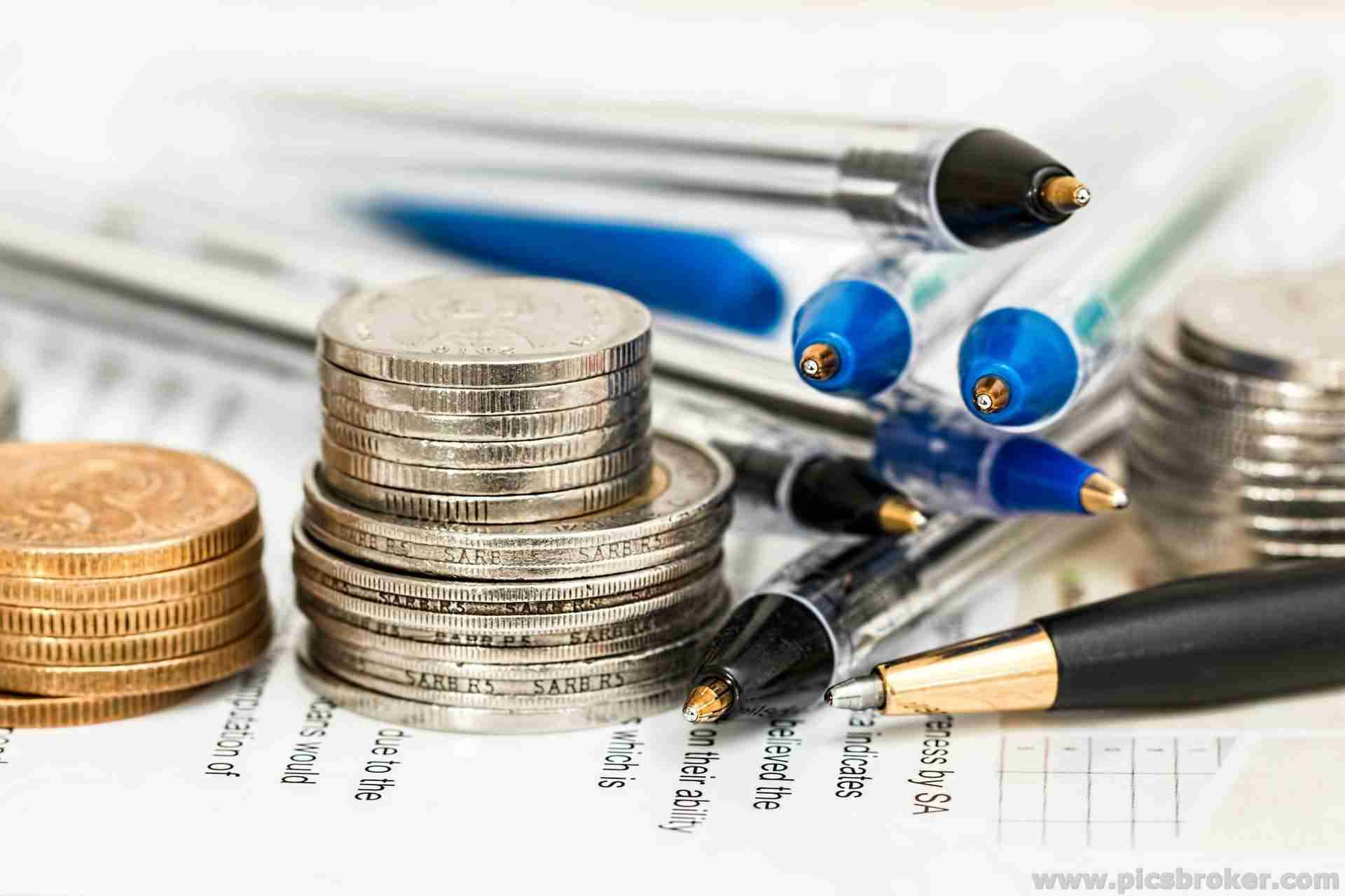 Finance Coins And Pens Background