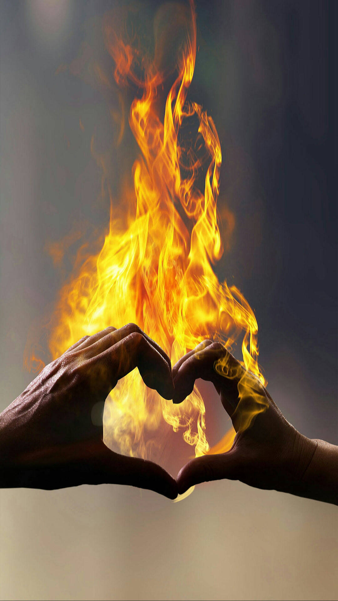 Unleashing the Power of Love: A Fiery Finger Heart Gesture Wallpaper