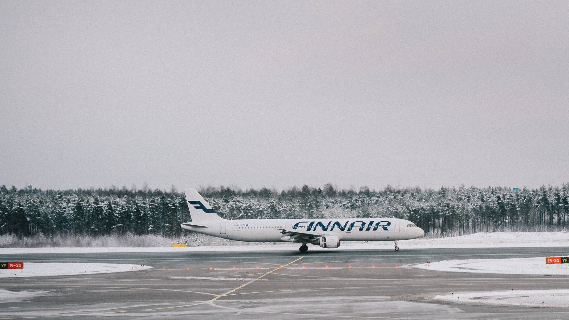 Caption: Finnair Aircraft Ready for Departure on Tarmac Wallpaper