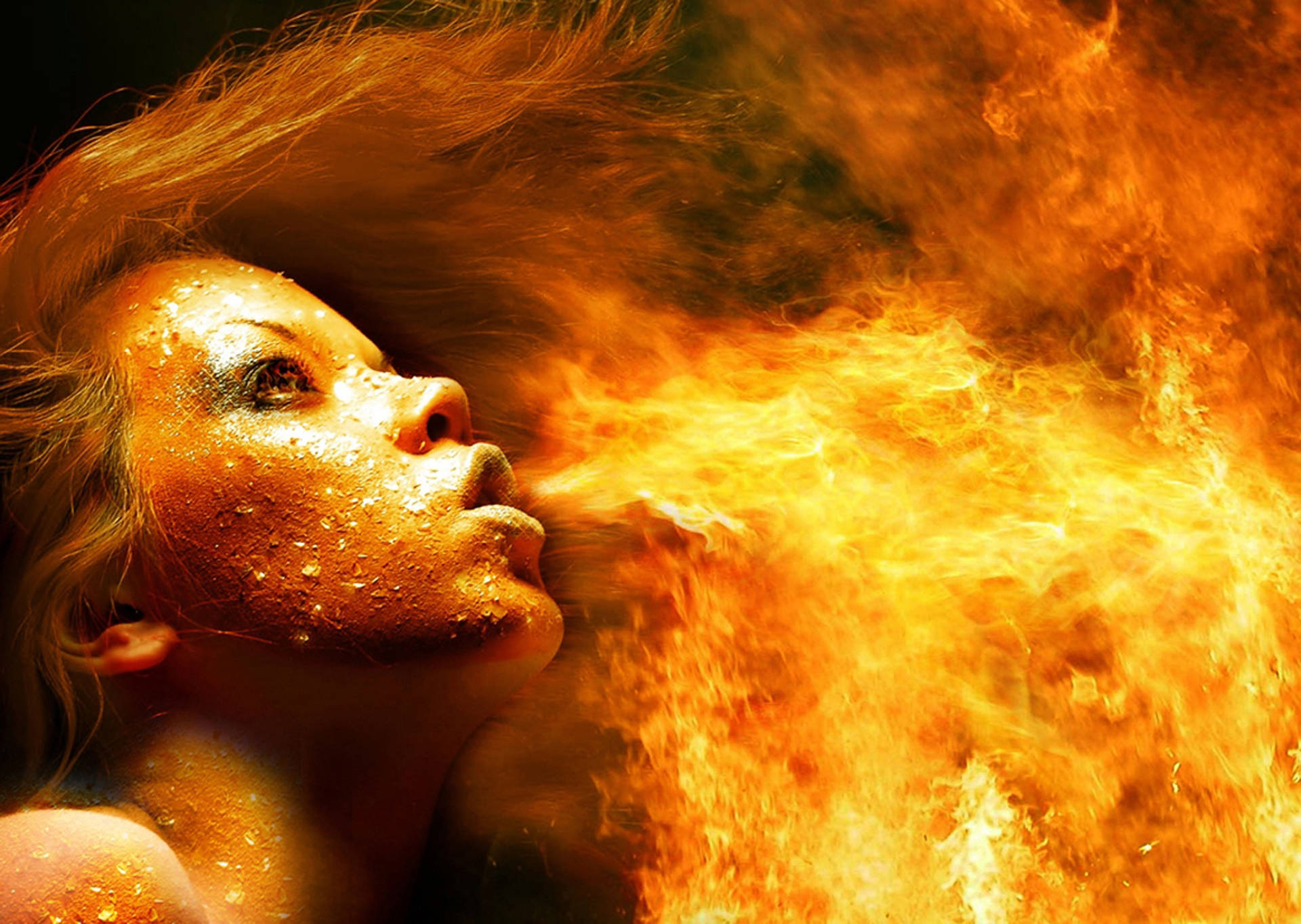 A Woman Channeling Power Through Fire Breathing Wallpaper