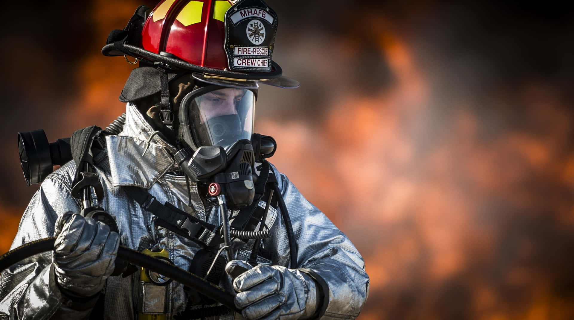 A Firefighter In A Firefighter Outfit Wallpaper
