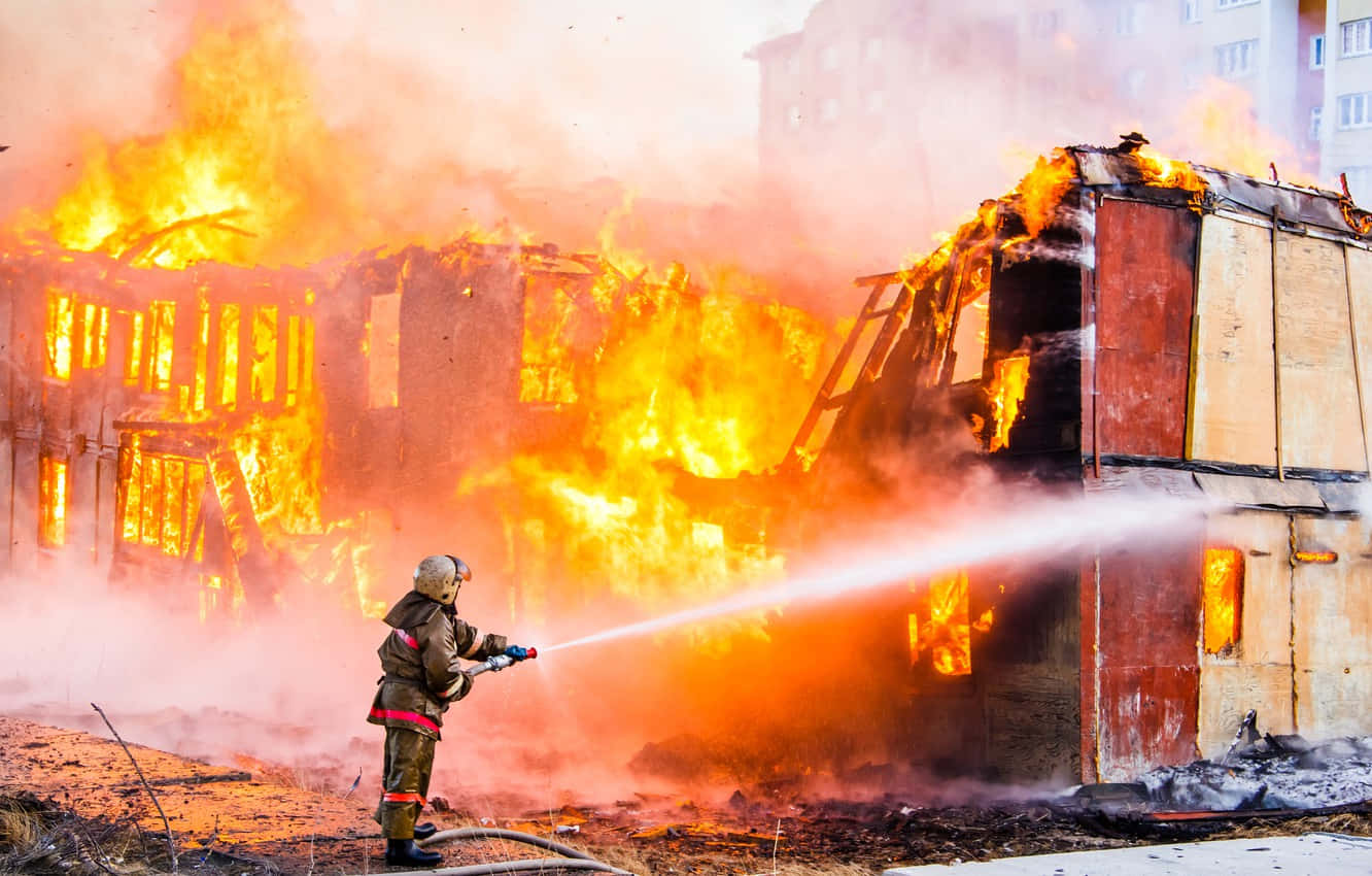 Firefighters battle a blazing inferno Wallpaper