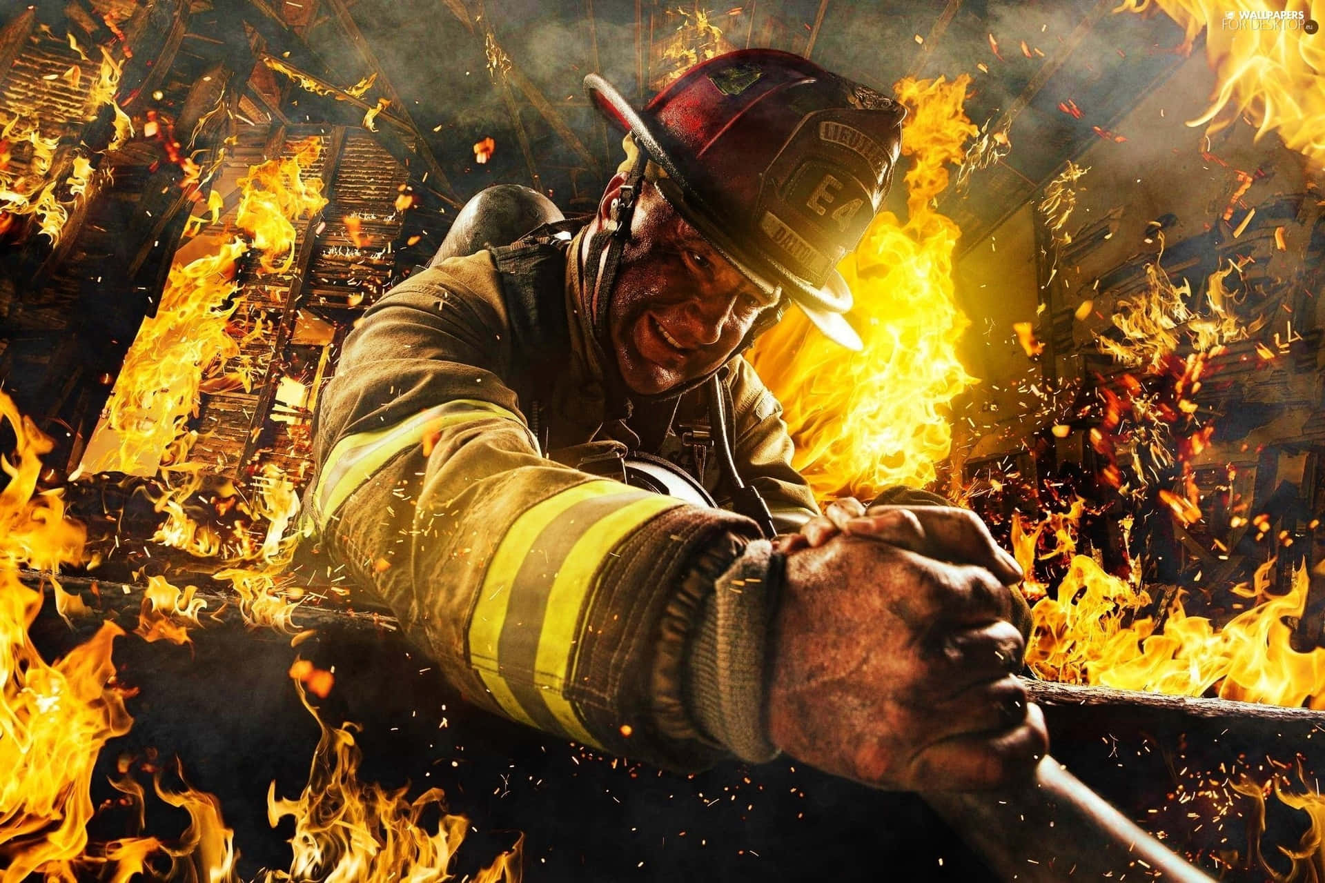 A Firefighter Is Holding A Fire Extinguisher In Front Of A Fire Wallpaper