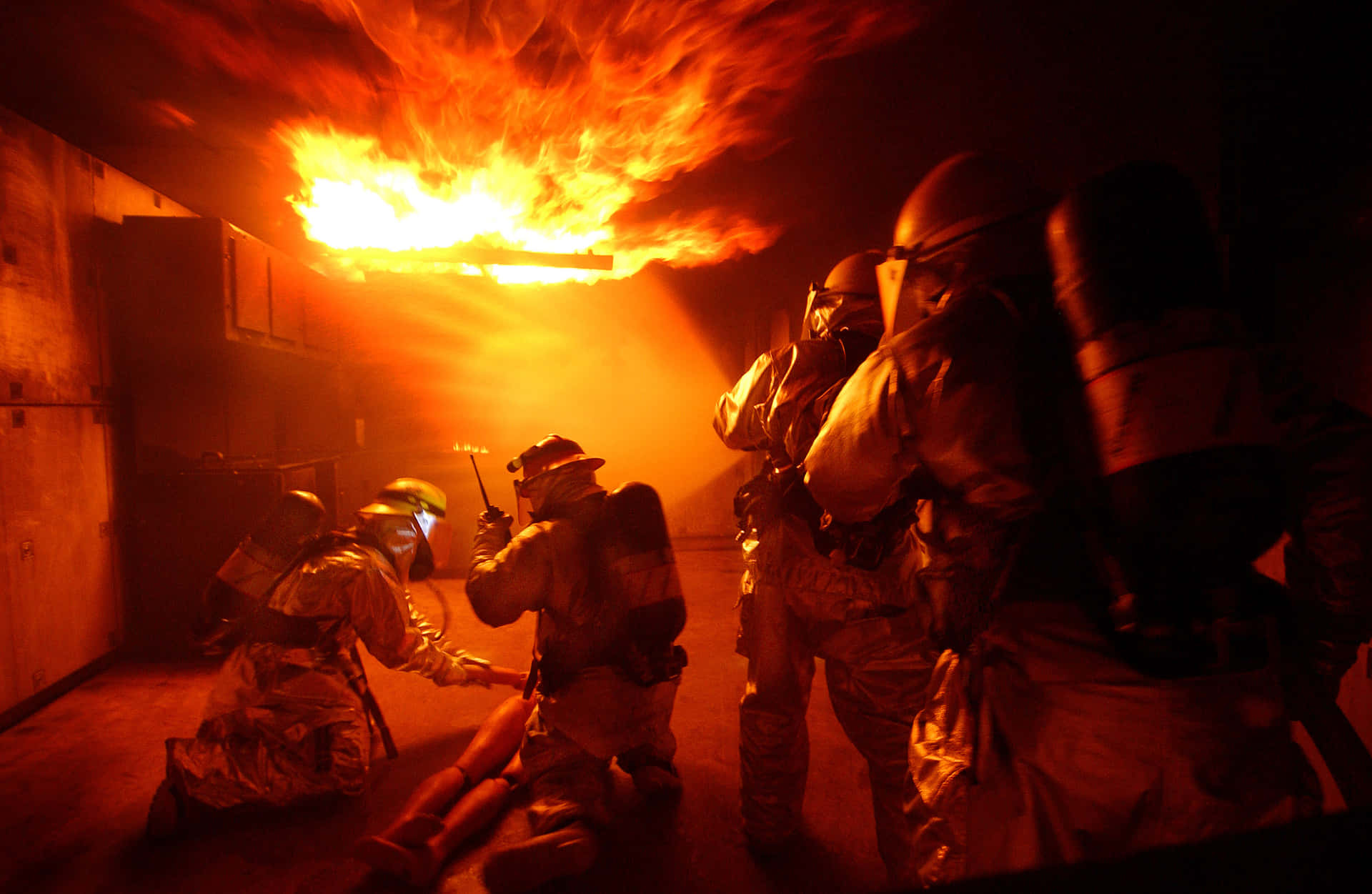 Brave fireman tackling a burning warehouse